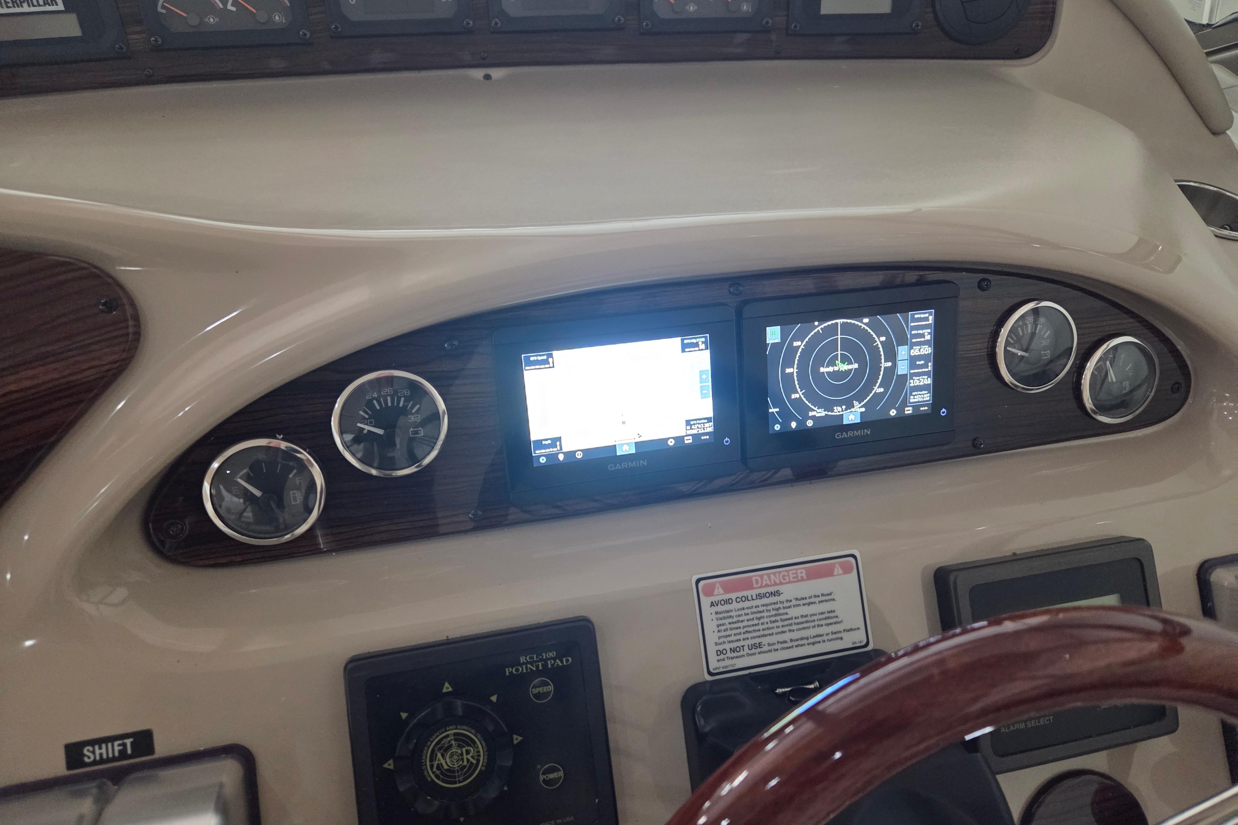 Control panel of a 2000 Sea Ray Sundancer 540 with Garmin navigation displays.