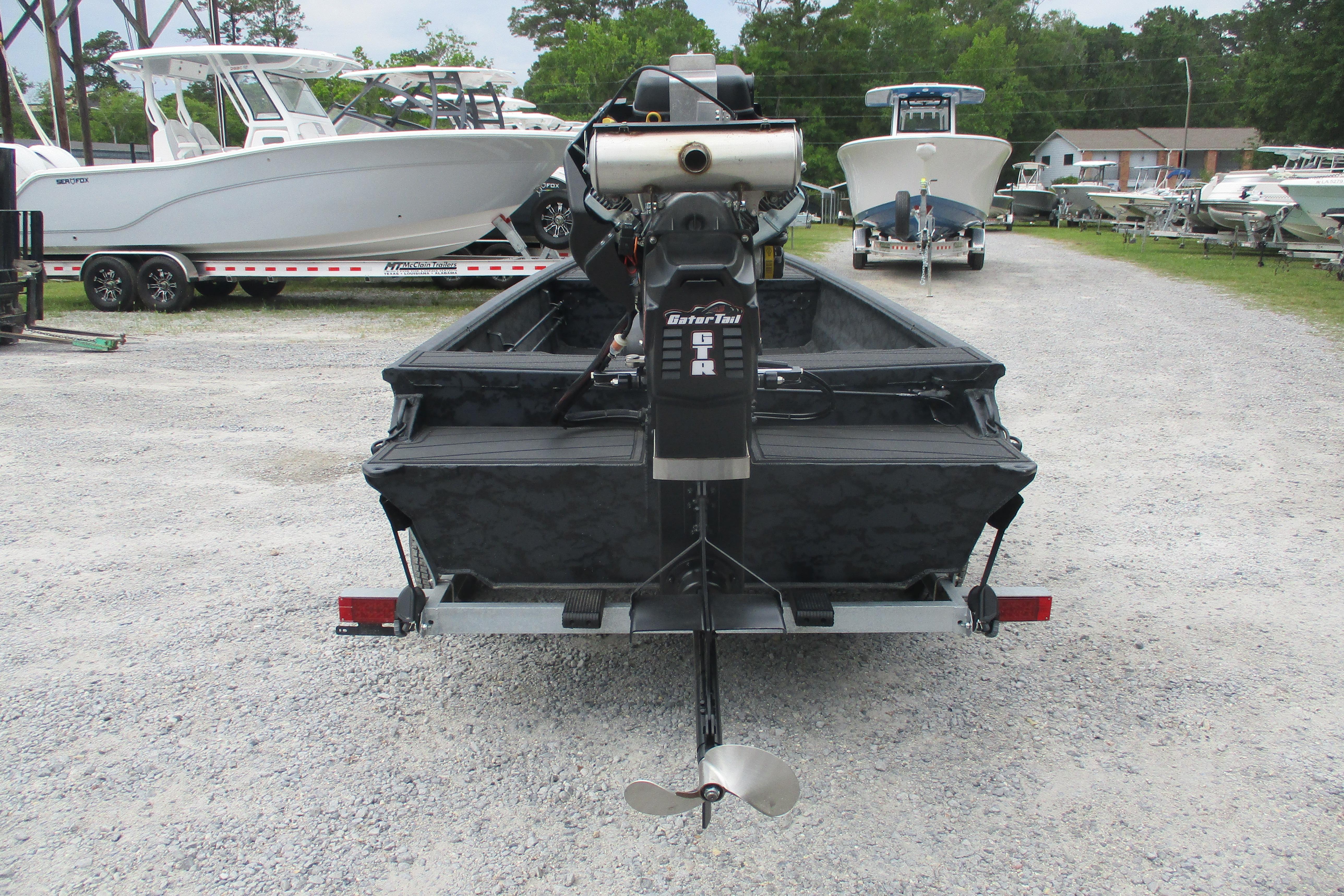 2026 Gator Tail 1860 Extreme CC boat on trailer, rear view in outdoor setting.