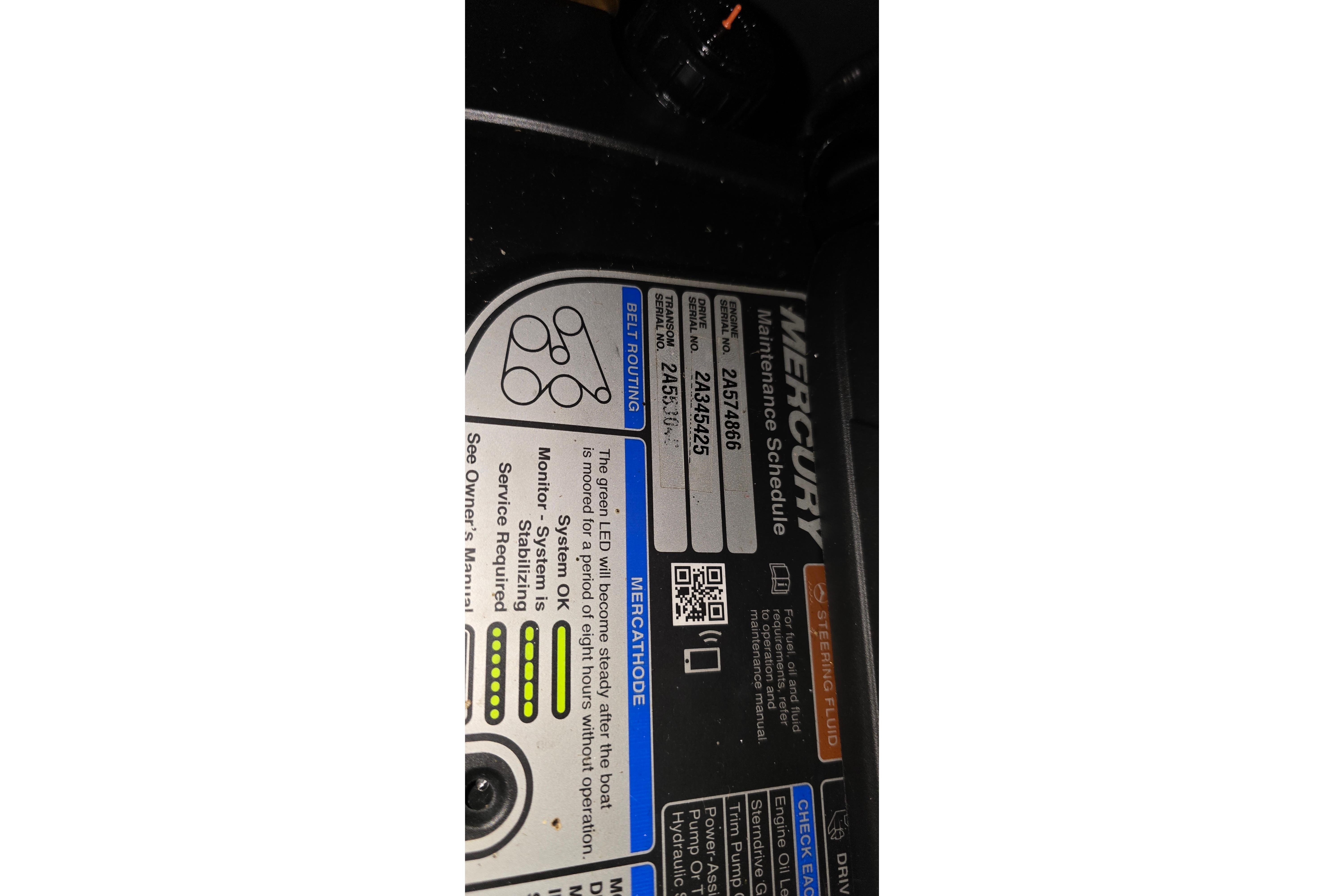 Label on a 2018 Four Winns V355 boat engine, detailing Mercury maintenance schedule.