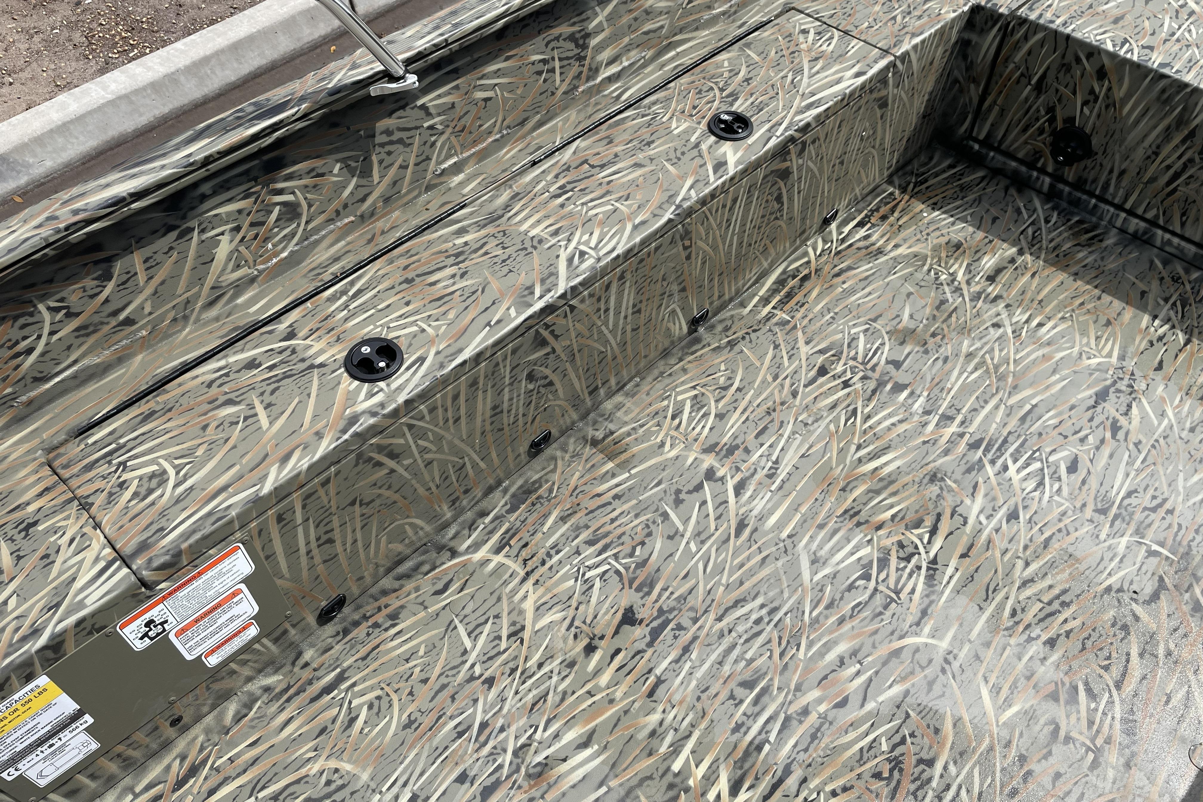 2026 Tracker Grizzly 1756 T Marsh boat interior with camouflage pattern design.