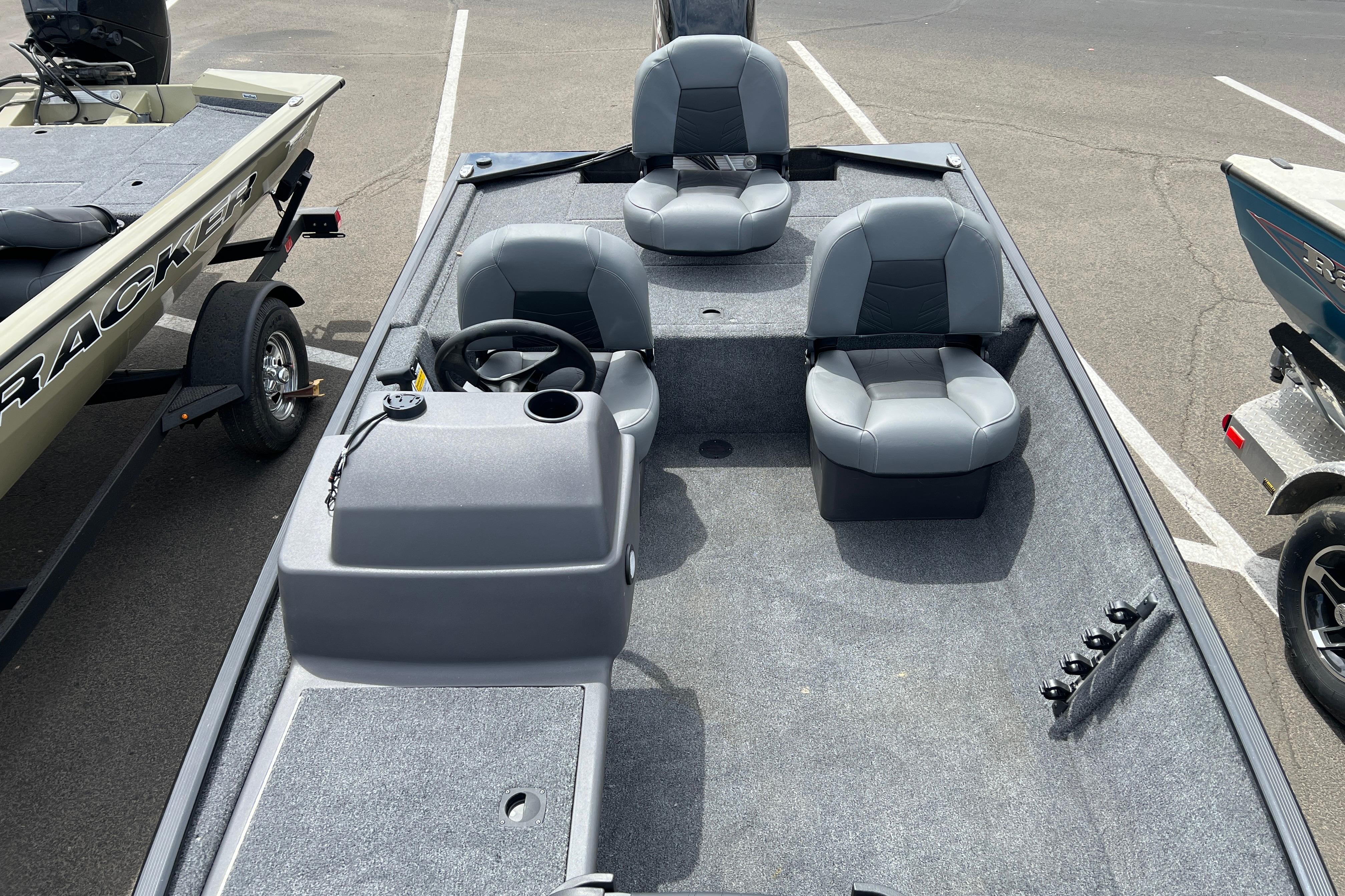 2026 Tracker Bass Tracker Classic XL boat interior with gray seating and steering console.