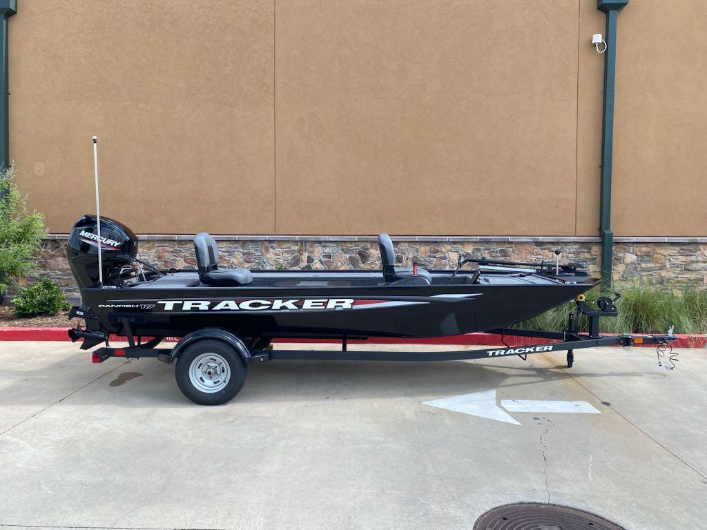 2025 Tracker Panfish 17 boat on trailer, parked outdoors, side view.