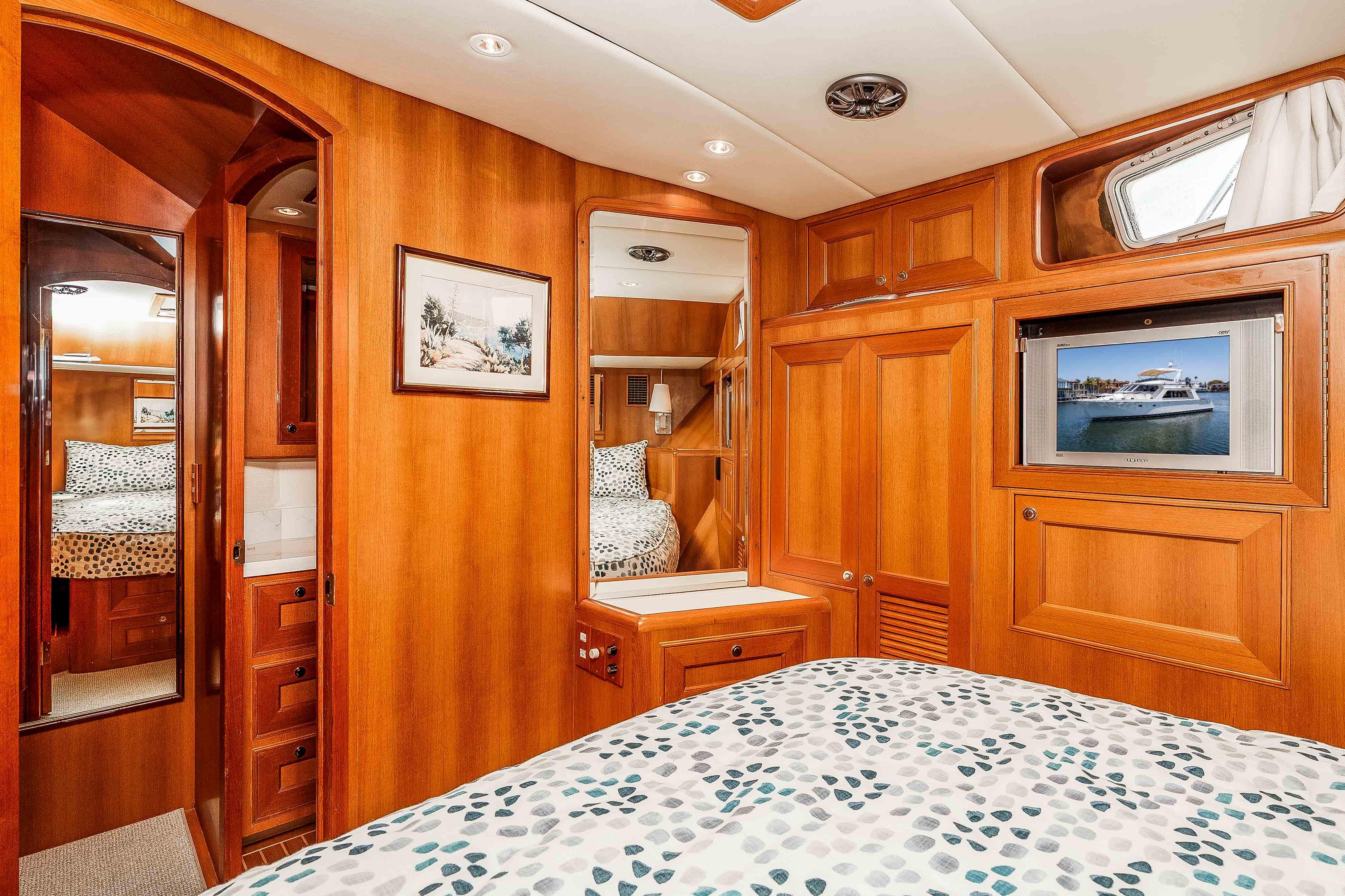Luxurious 2005 Offshore Yachts 54 Pilothouse cabin with elegant wood interior.