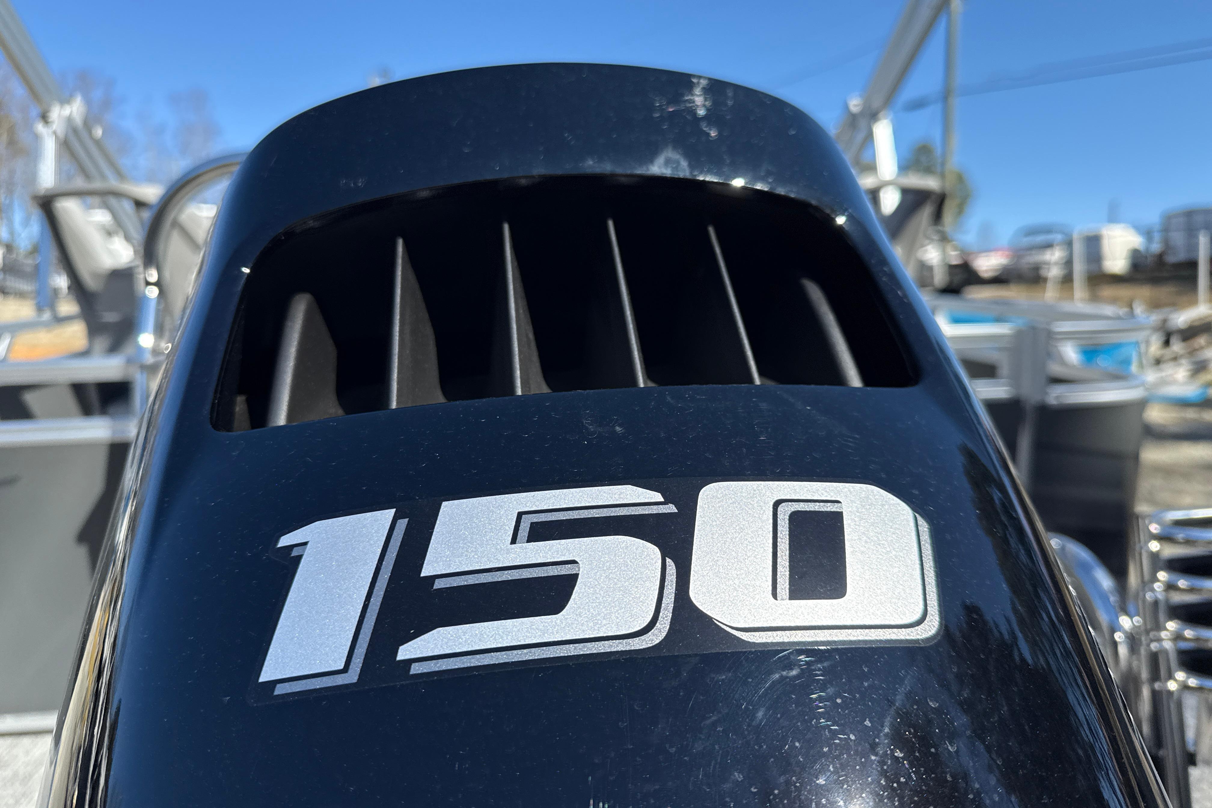 Close-up of a 150 horsepower engine on a 2026 Tahoe Pontoon Sport 85 Rear Fish.