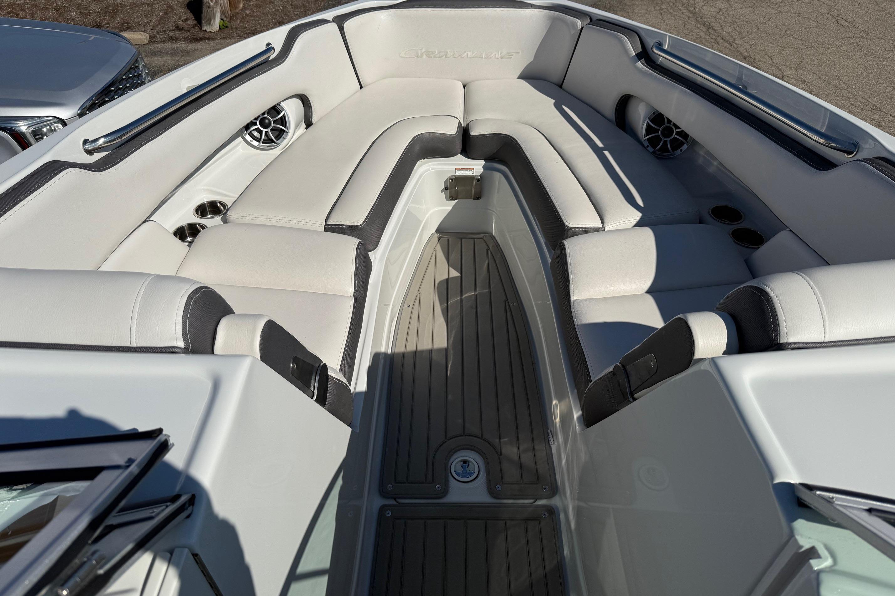 2023 Crownline 290 SS boat interior with white seating and cup holders.