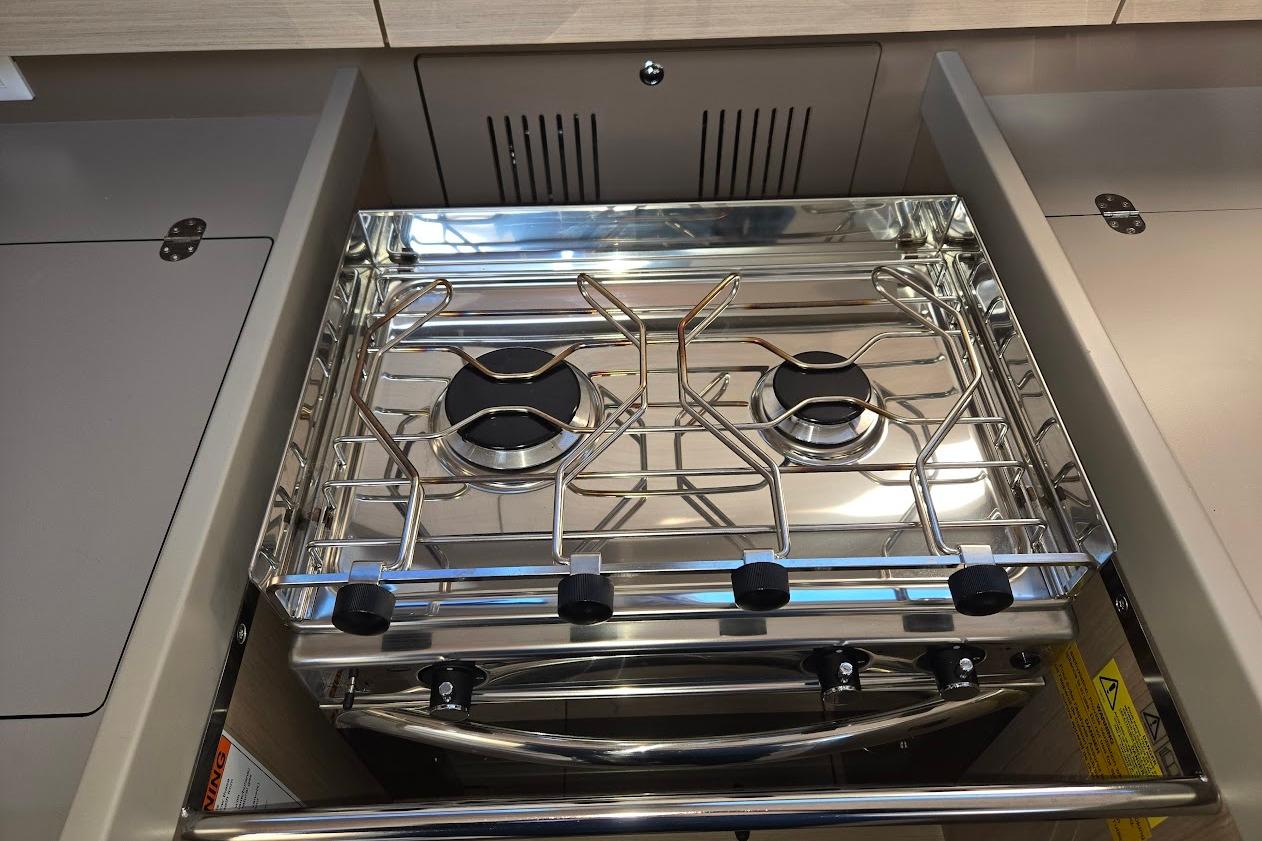 Stainless steel stove in 2023 Beneteau Oceanis 38.1 yacht kitchen.