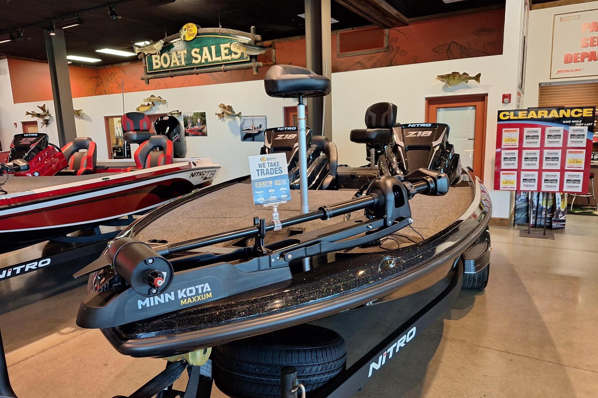 2026 Nitro Z18 boat displayed in showroom with trade-in sign.