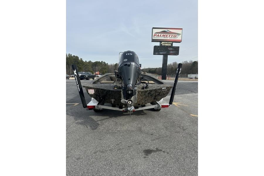 2026 Xpress H190B Bay boat with outboard motor in parking lot.