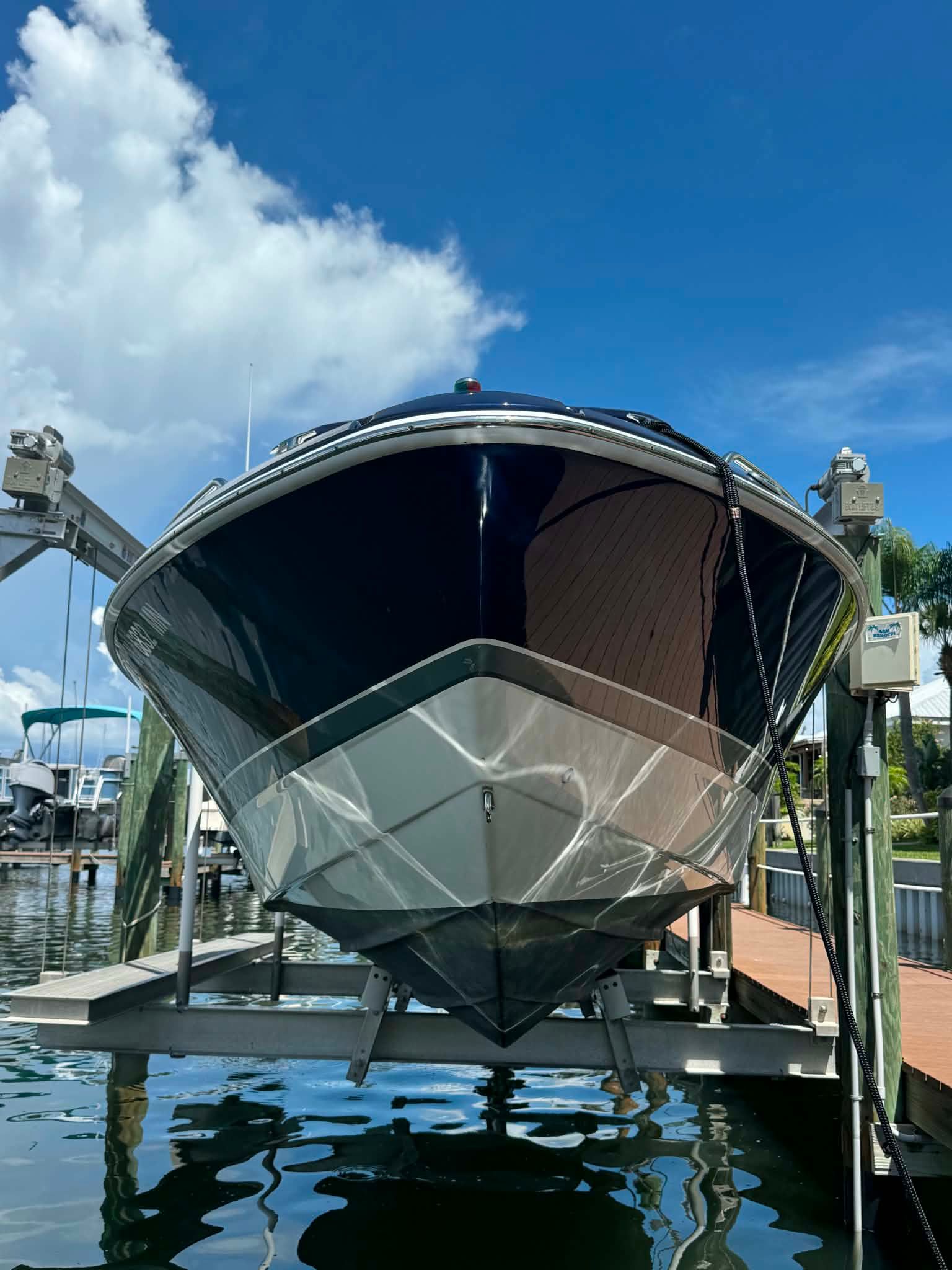 2018 Formula 270 Bowrider on a boat lift at the dock.