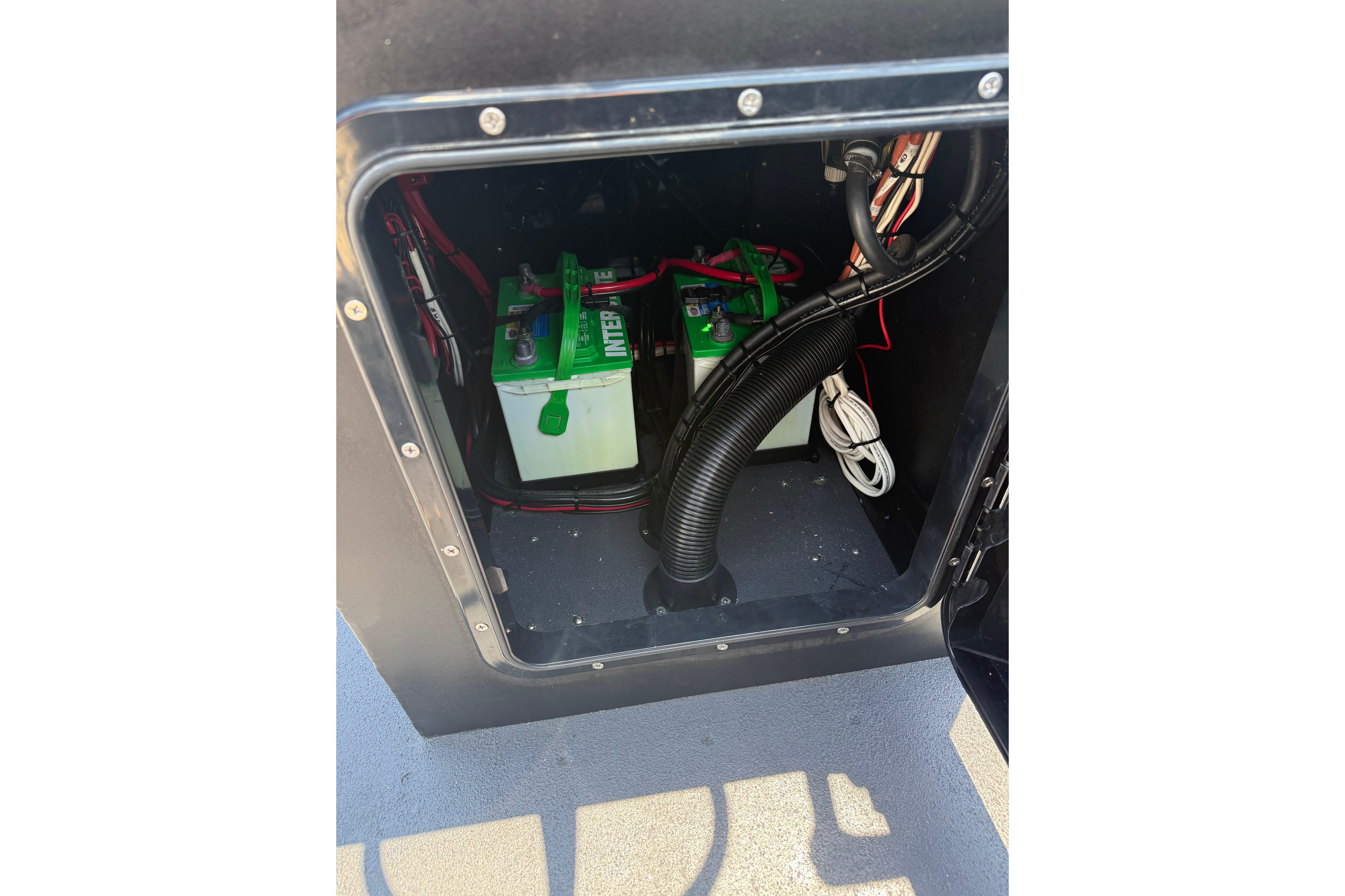 Battery compartment of Tough 20 model, showcasing wiring and components, 2026.
