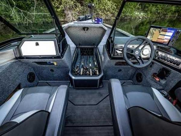 Interior of 2026 Lund 2075 IMPACT XS boat with modern dashboard and seating.