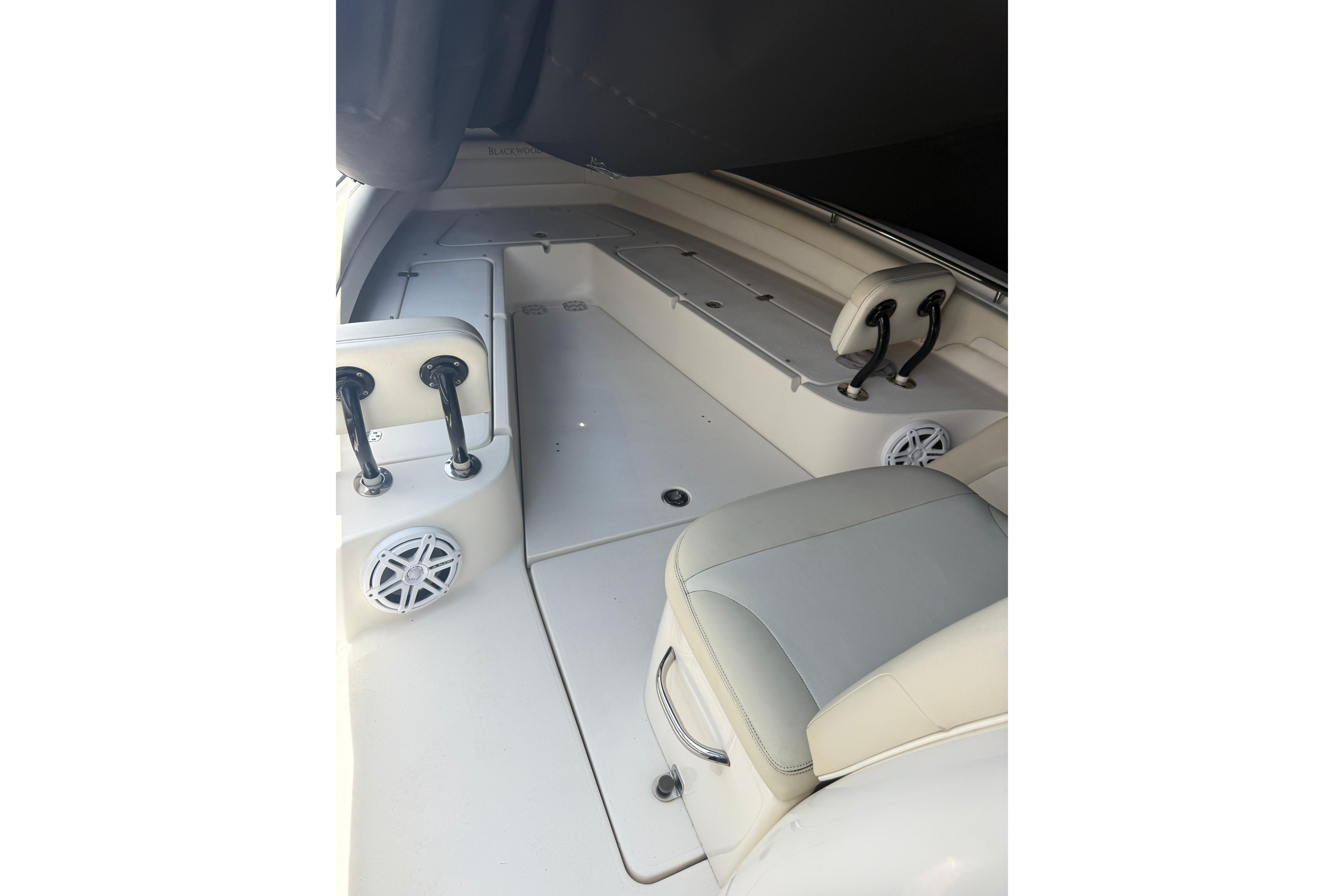Interior of a 2015 Blackwood 27 boat featuring seating and speakers.