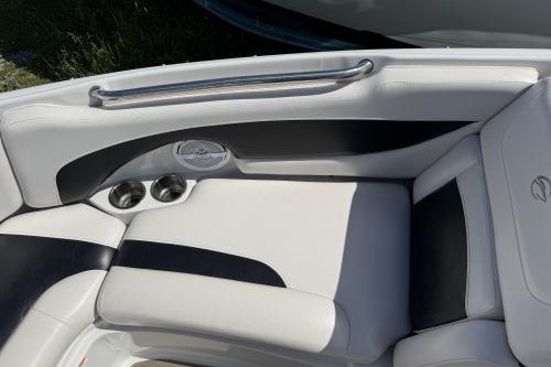 2012 Crownline 215 SS boat interior with white and black seating, cup holders, and speaker.