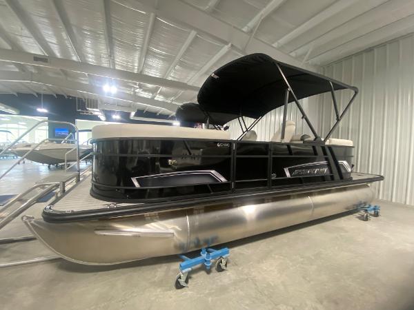 2024 Starcraft EXS 1 pontoon boat in showroom.