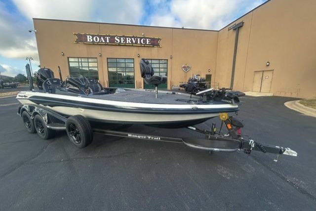2026 Ranger Z521R boat parked outside a boat service center on a sunny day.