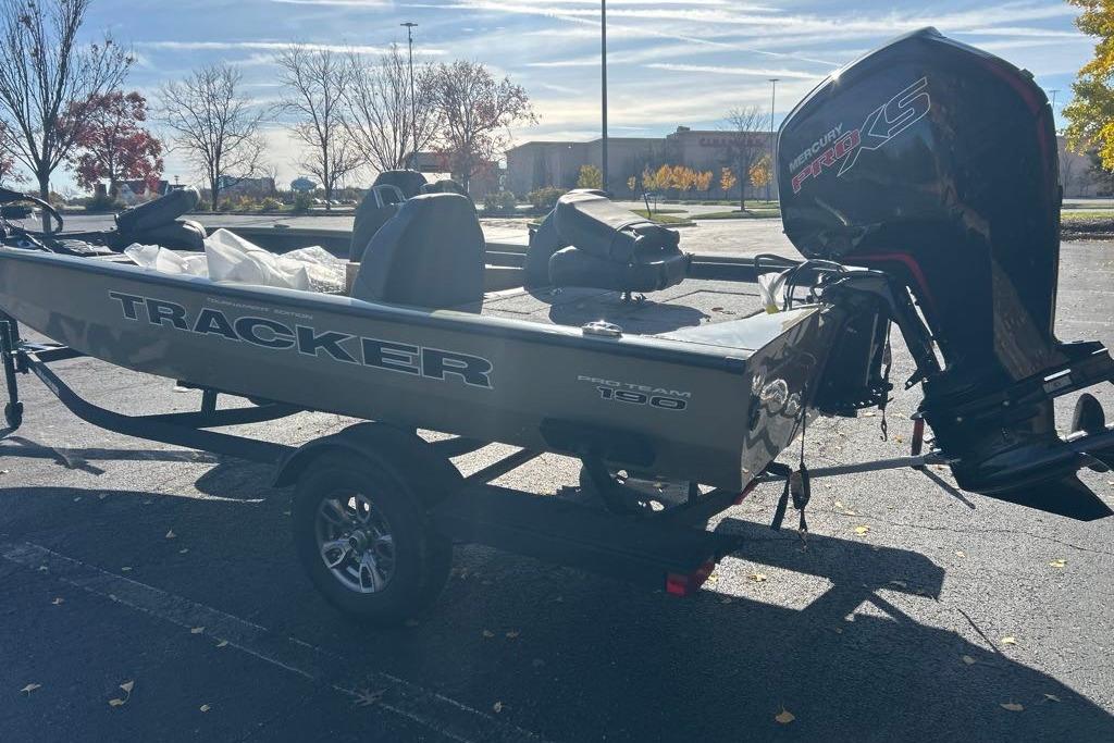 2026 Tracker Pro Team 190 boat with Mercury Pro XS engine in parking lot.