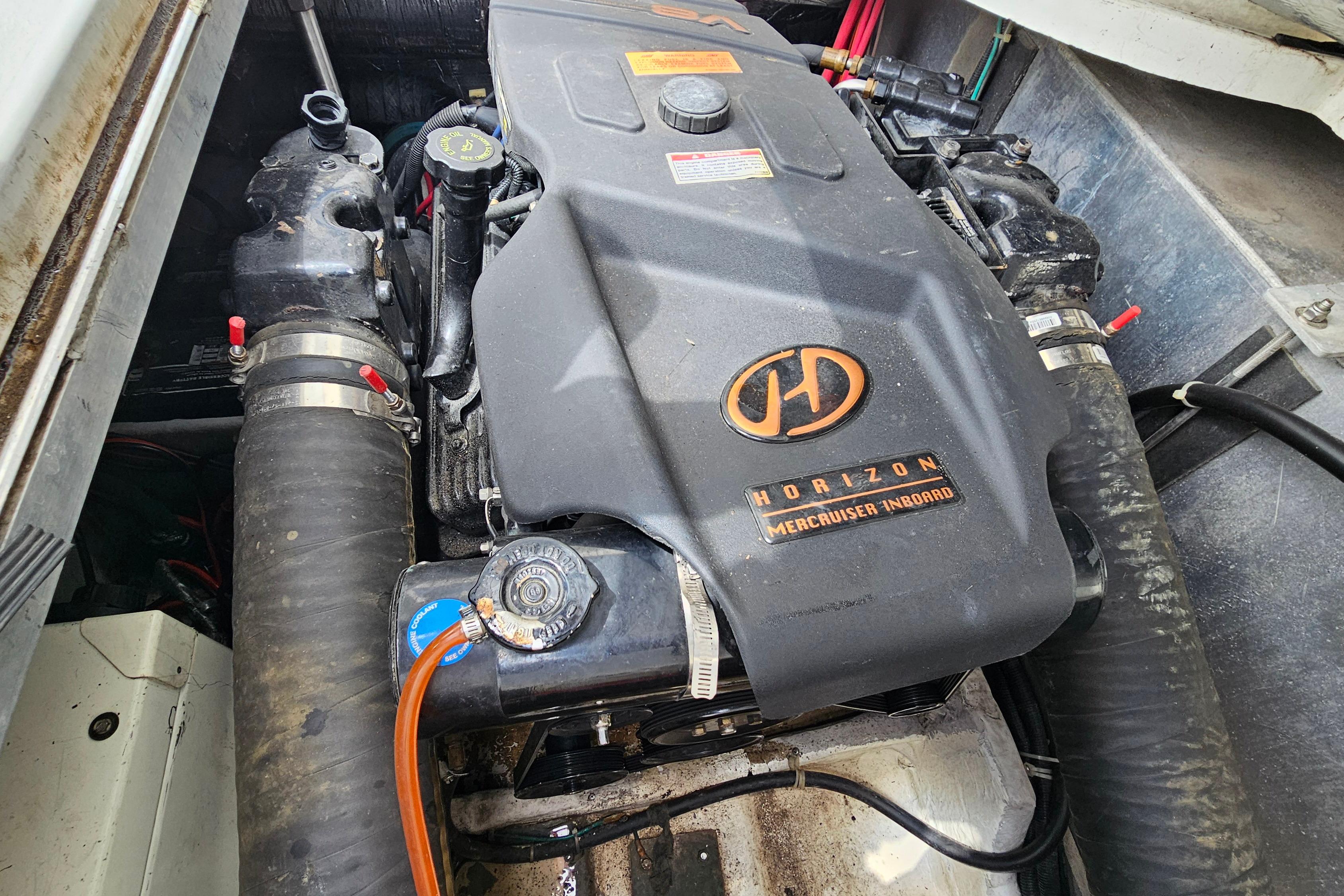Engine compartment of a 1999 Carver 350 Mariner with Horizon MerCruiser inboard engine.