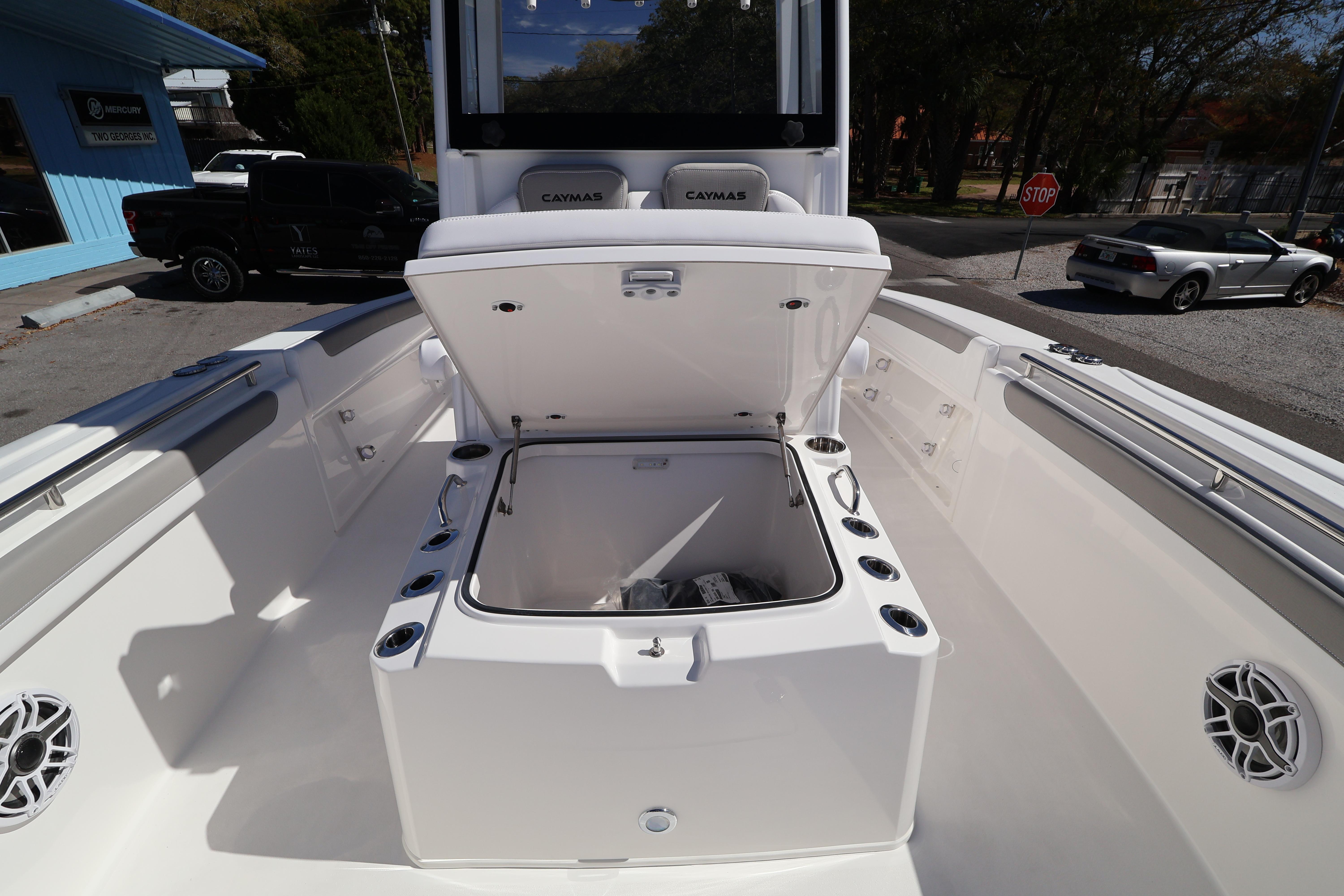 2026 Caymas 291 boat interior with open storage compartment and seating.