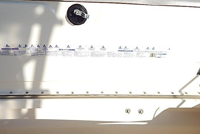 2003 World Cat 270 EC boat interior with safety instructions and fuel cap.