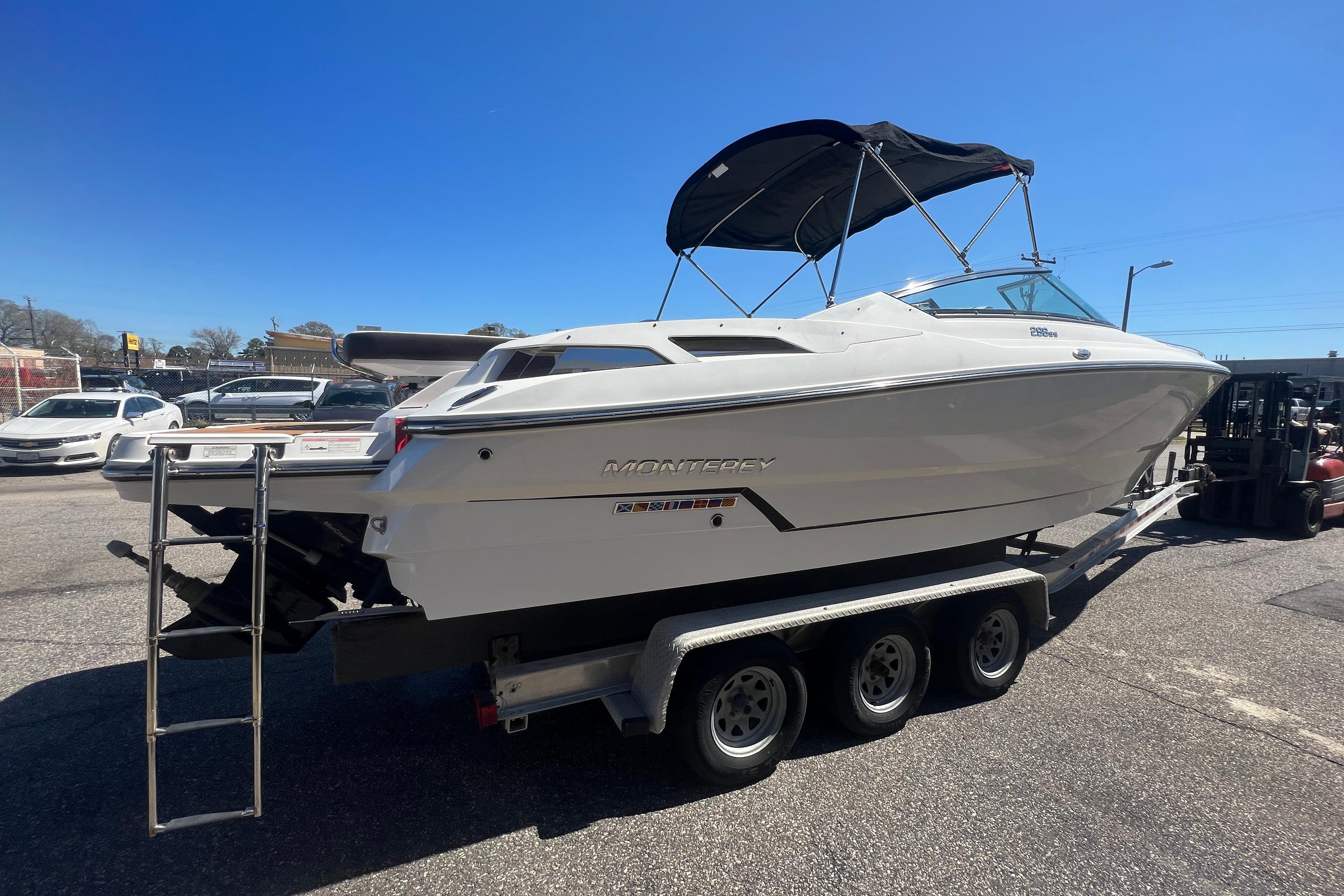 2017 Monterey 298SS Super Sport boat on a trailer under clear blue sky.