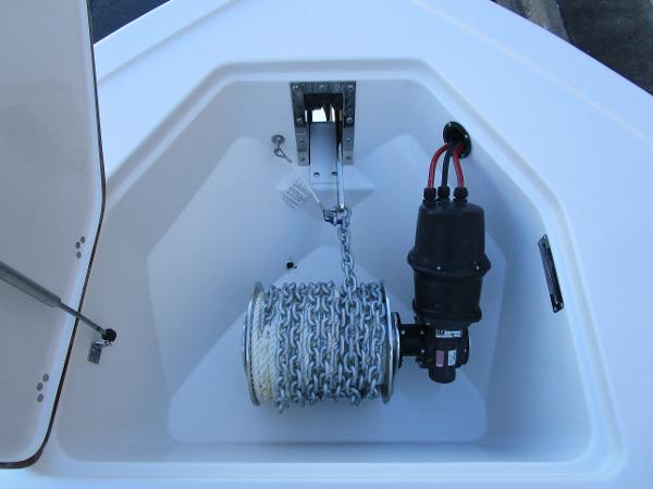 Anchor storage compartment of 2025 Sea Pro 292 Offshore boat with chain and winch.