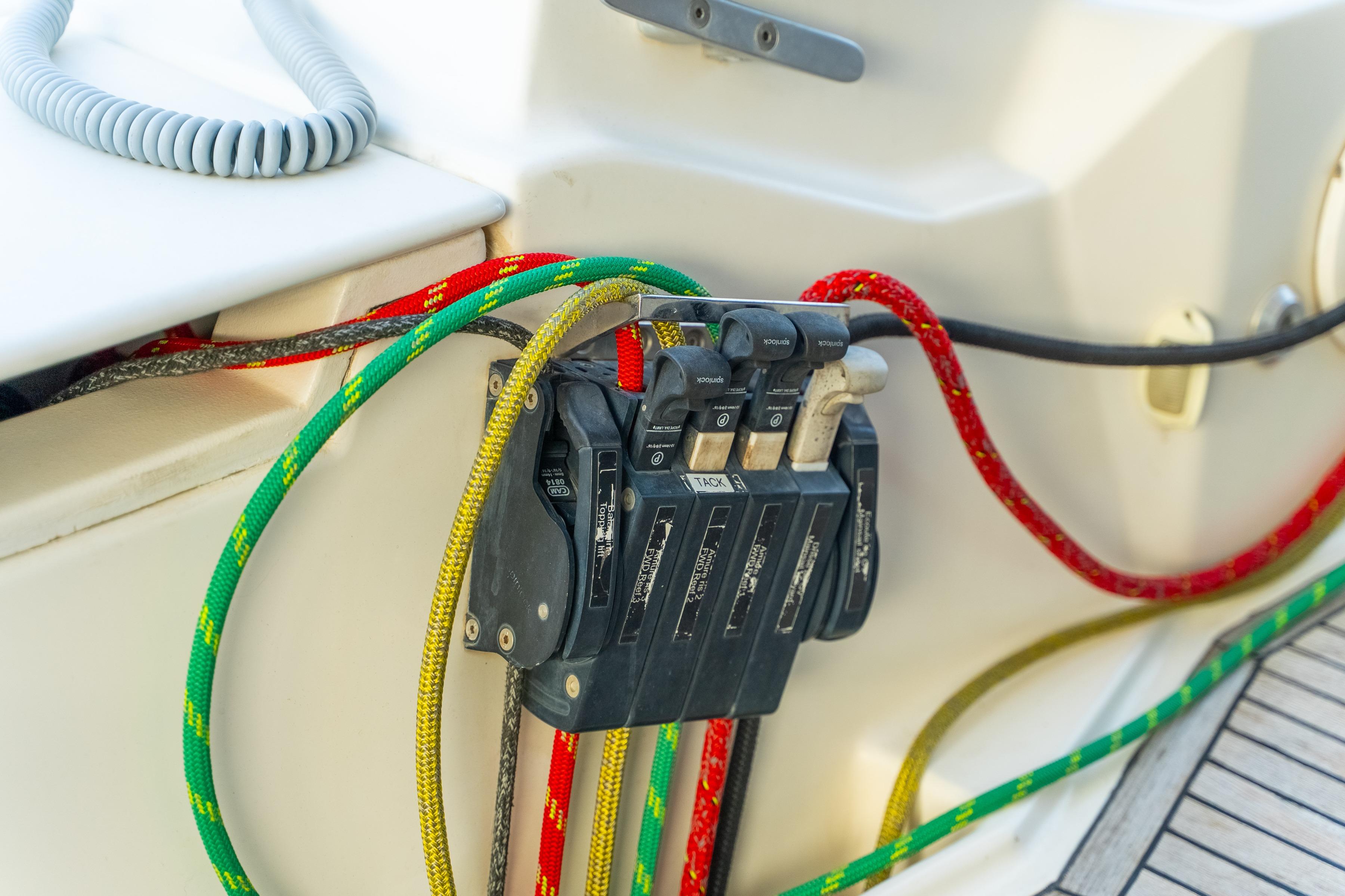 Control panel with colorful ropes on a 2009 Catana 65 yacht.