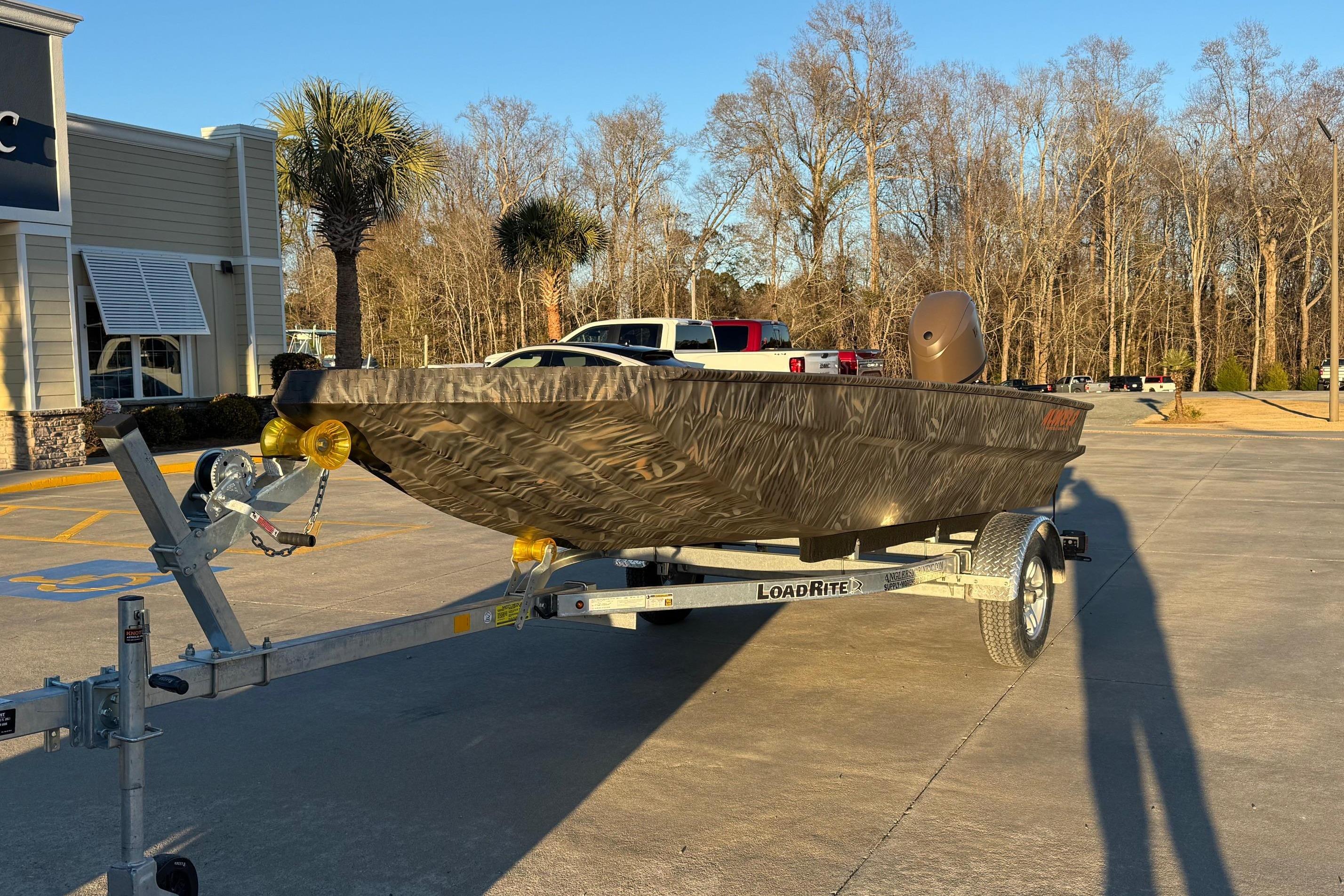 2026 Alweld 1652 Invader boat on Load Rite trailer in parking lot.