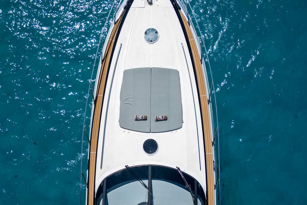 Top view of 2005 Princess V58 yacht on clear blue water.