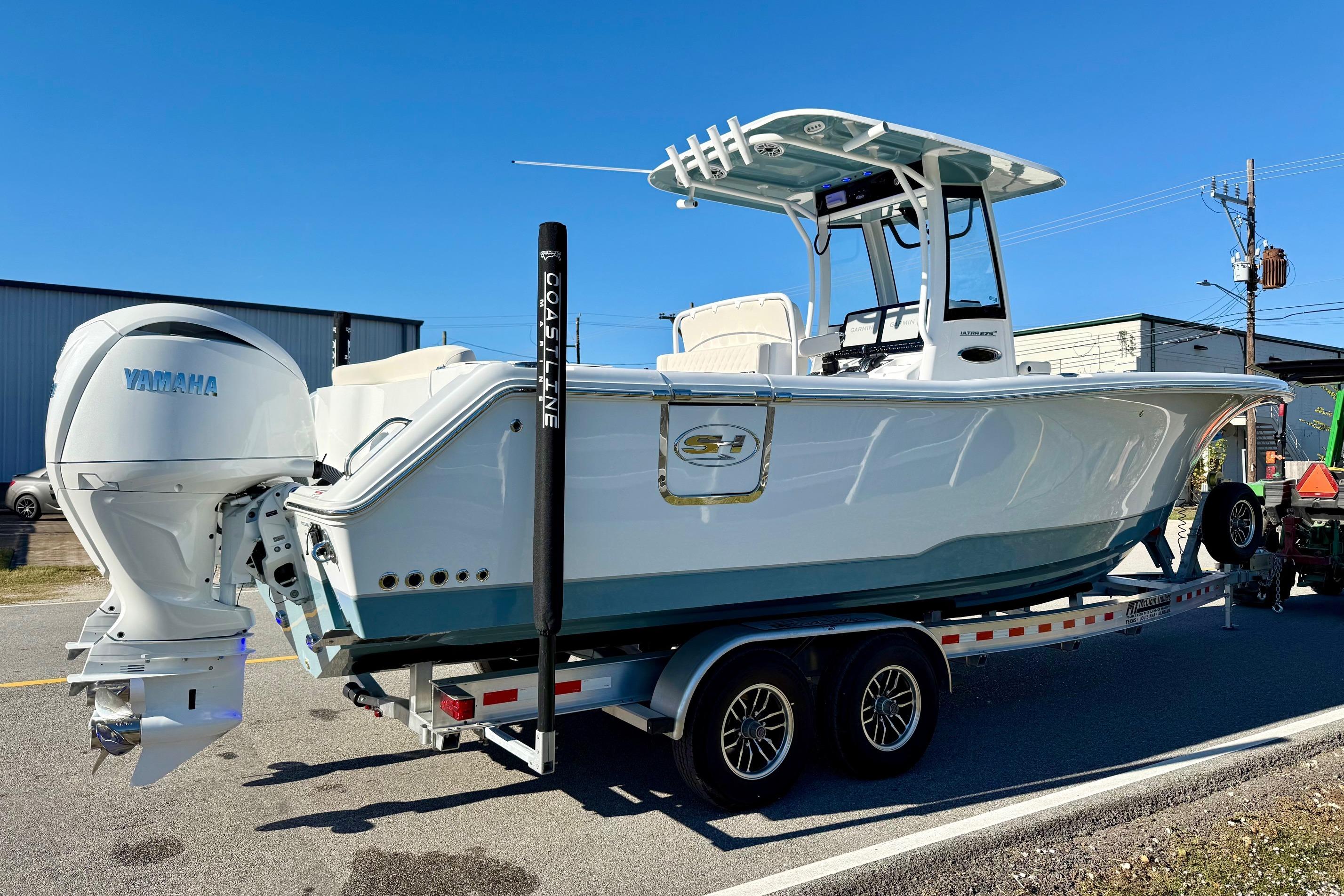 2026 Sea Hunt Ultra 275 Coffin Box boat on trailer, featuring Yamaha engine.