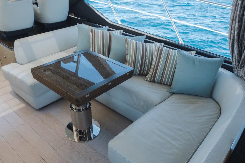 Luxurious interior of 2020 Azimut 60 yacht with elegant seating and ocean view.
