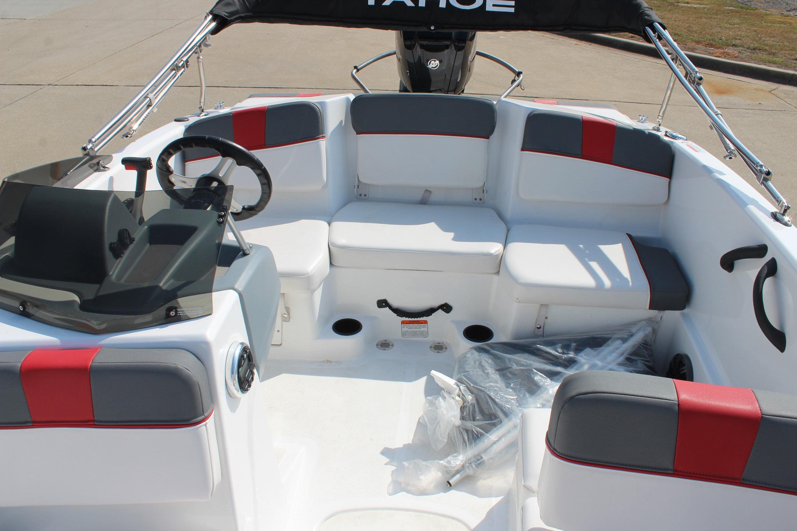 2023 Tahoe T16 boat interior with seating, steering wheel, and modern design.