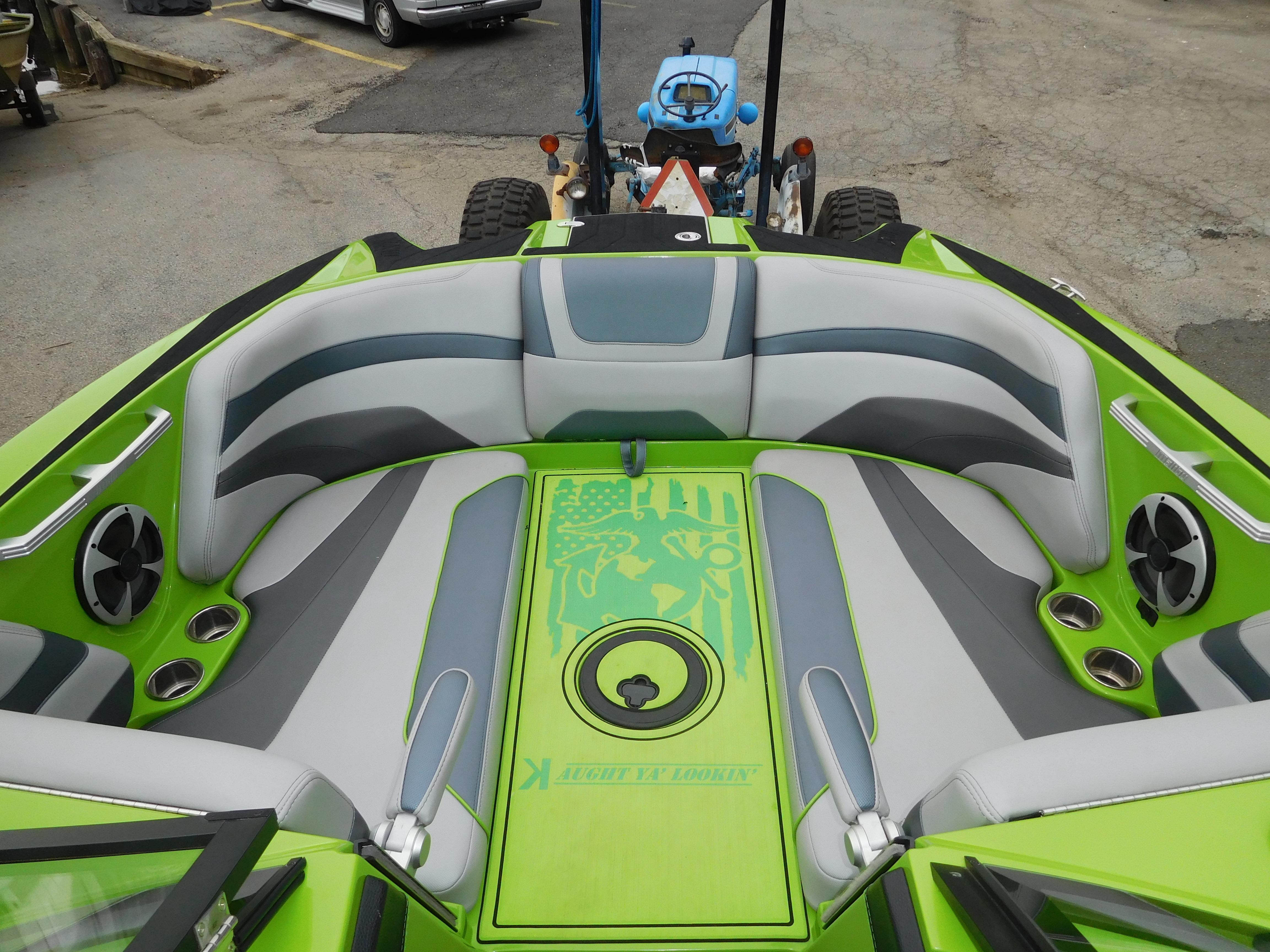 2017 Malibu Wakesetter 24 MXZ boat with green and gray interior.