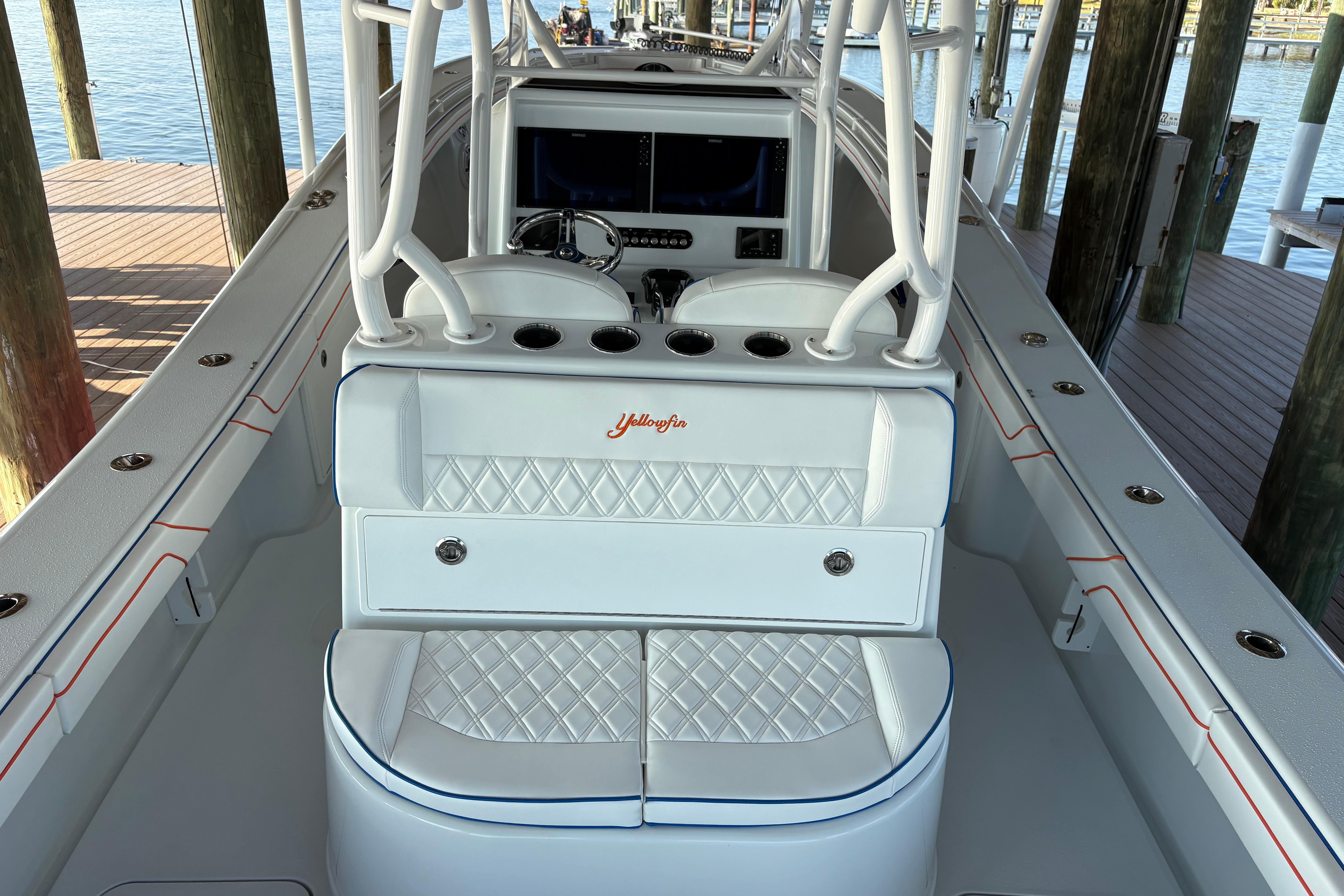 2024 Yellowfin 36 Offshore boat interior with white seating and diamond stitching.
