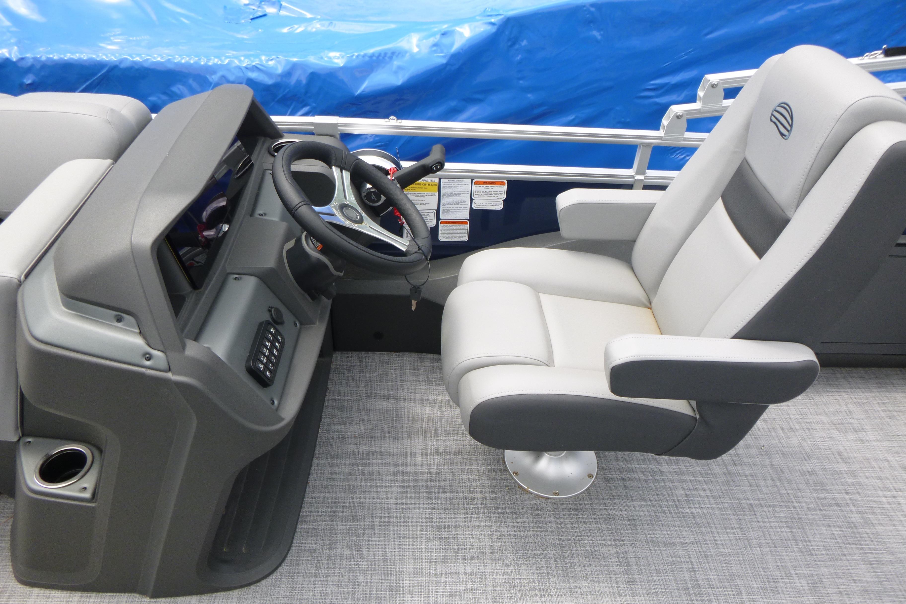 Captain's chair and helm of 2026 Sun Tracker SportFish 22 DLX pontoon boat.