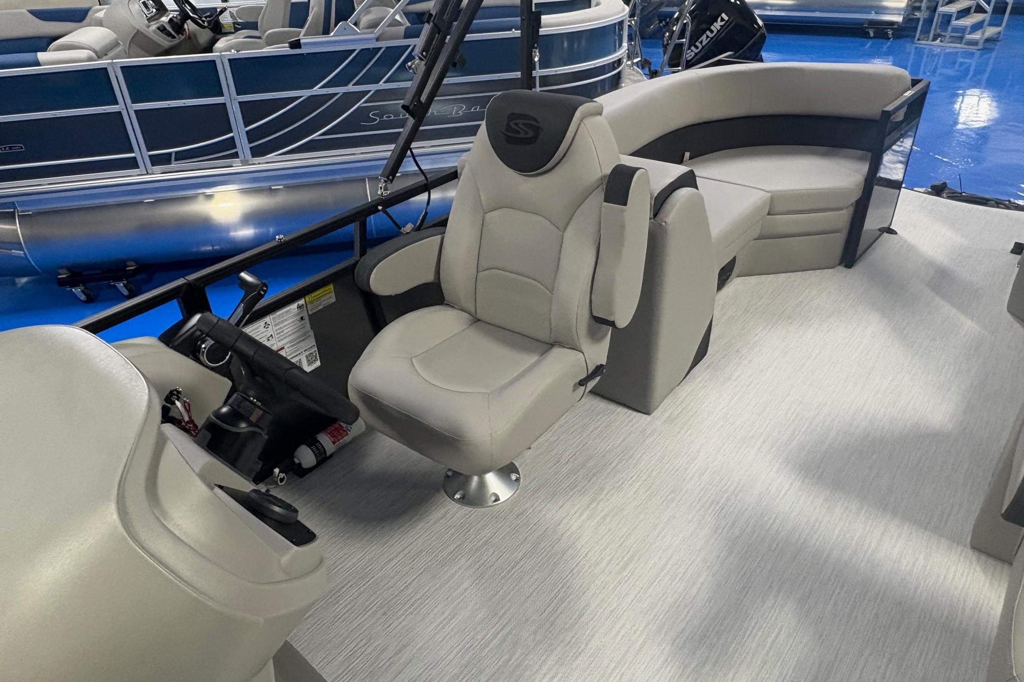 Interior of 2026 Dockside 22DQ boat with modern seating and steering console.