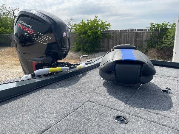 2025 Ranger RT188P boat deck with Mercury Pro XS engine, outdoor setting.