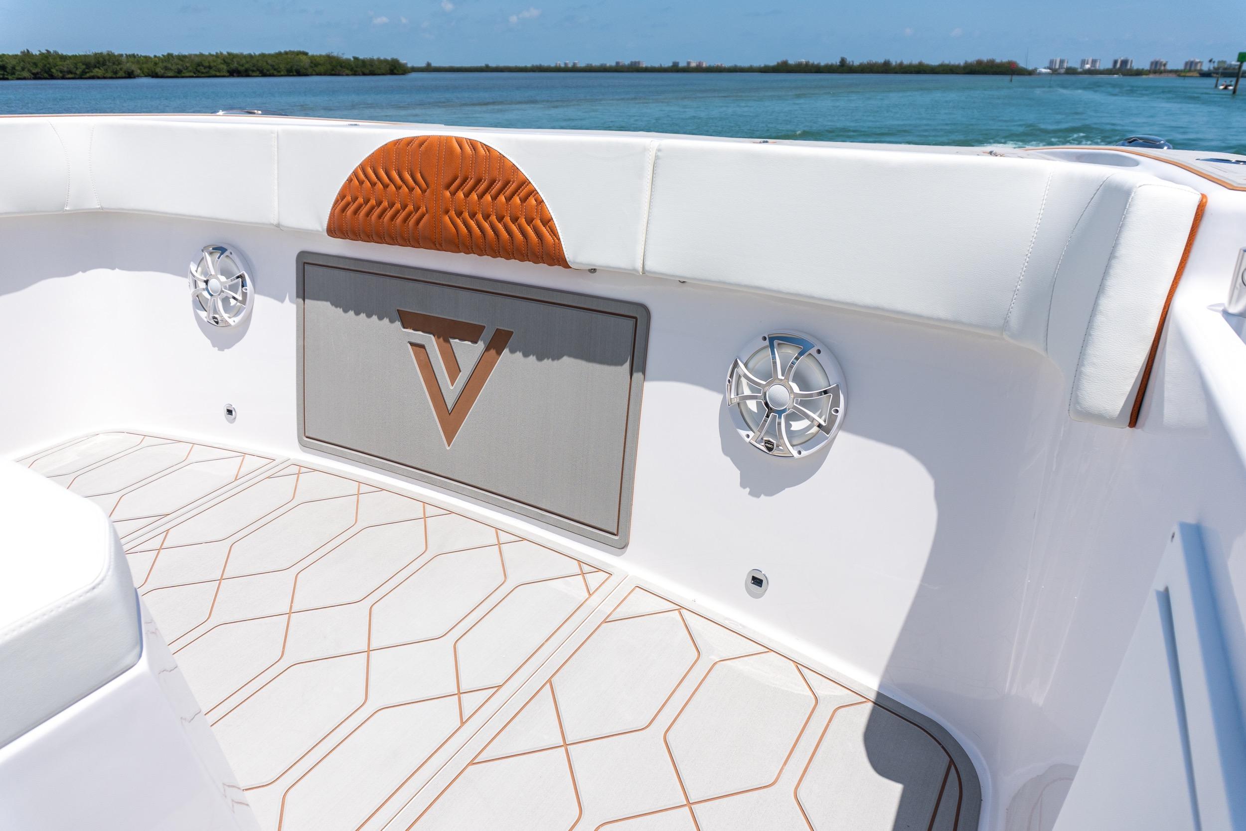 2026 Twin Vee 400 GFX2 CC boat interior with stylish seating and speakers.