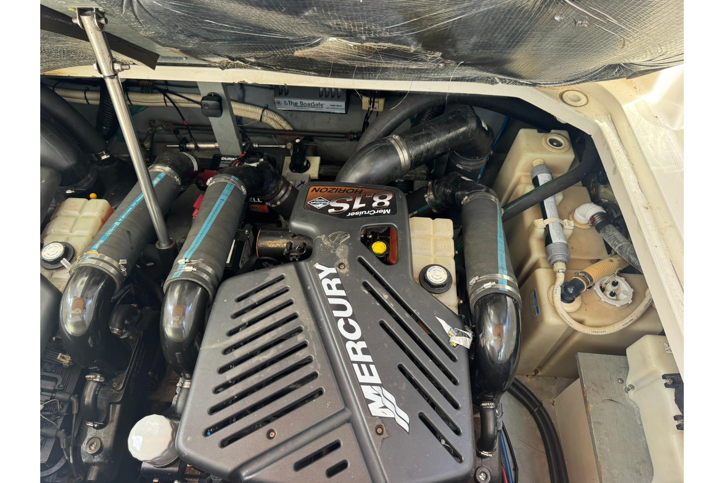 Engine compartment of a 2001 Sea Ray 340 Sundancer with Mercury components.