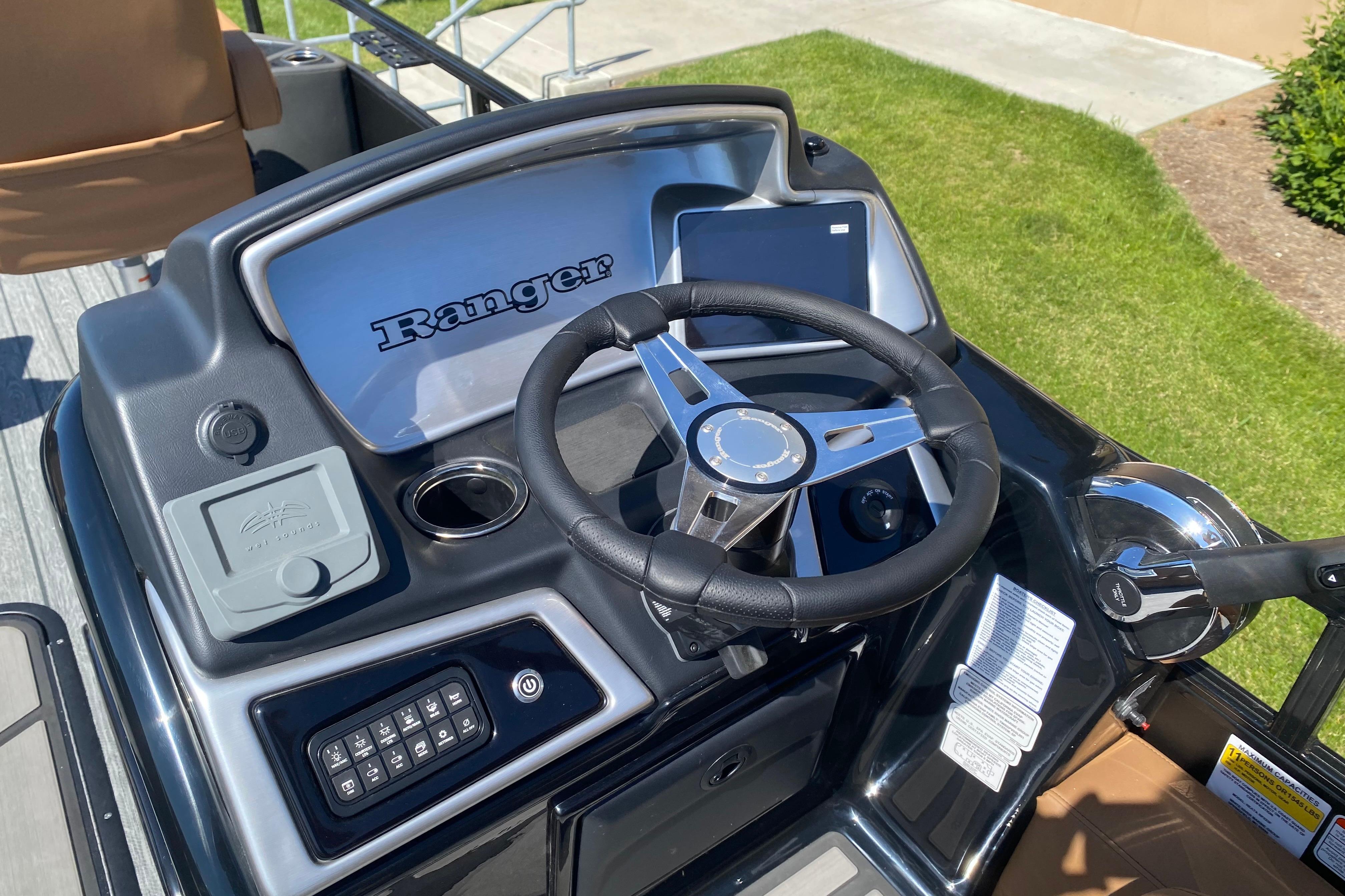 Steering console of 2026 Ranger 223F boat with modern controls and sleek design.