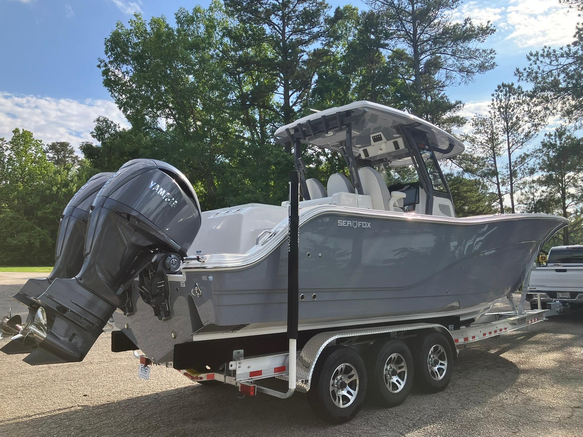 2025 Sea Fox 328 Commander boat on trailer, featuring dual Yamaha outboard engines.