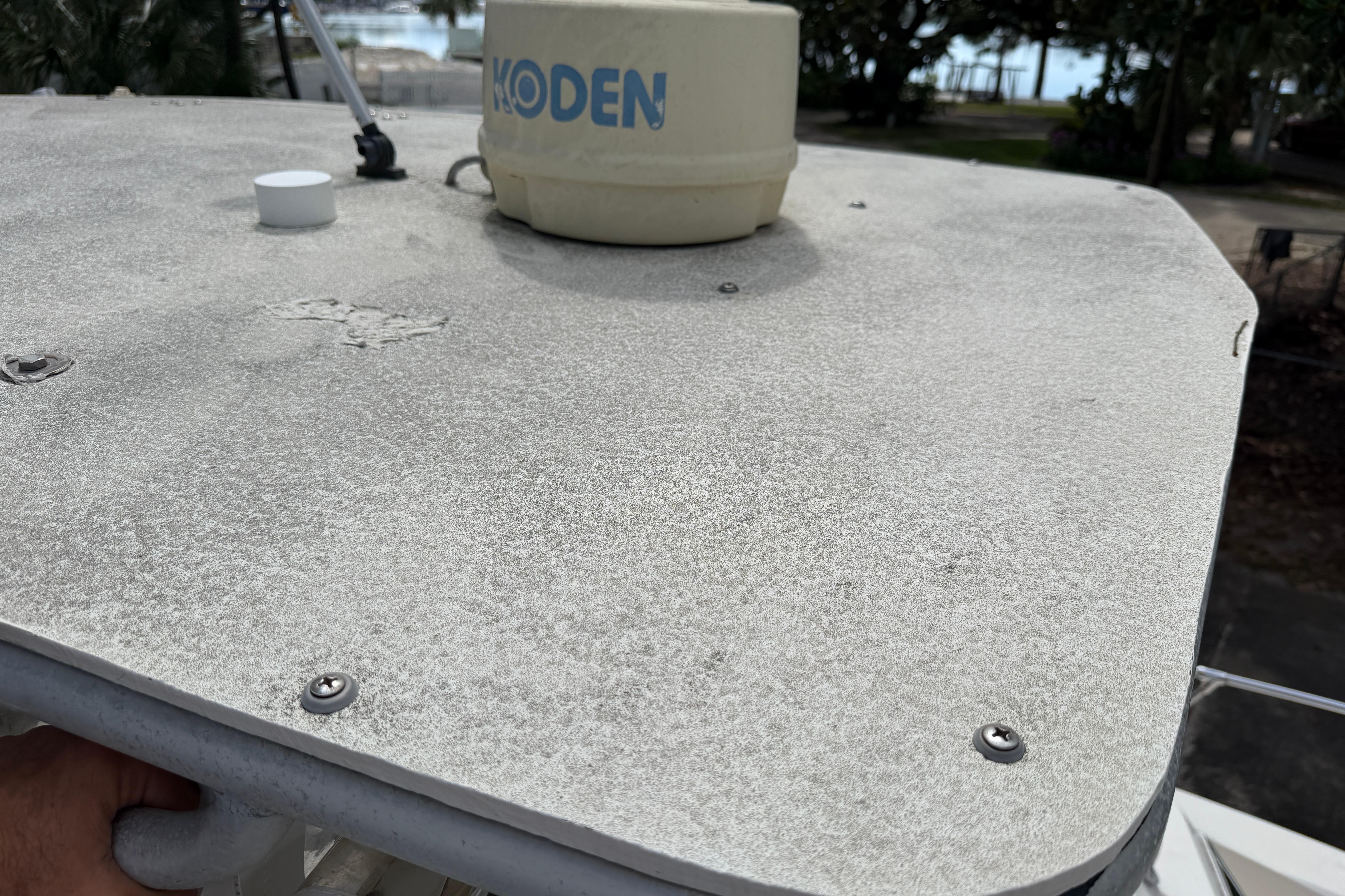 1987 Grady-White Seafarer 226 boat deck with radar equipment, showing weathered surface.