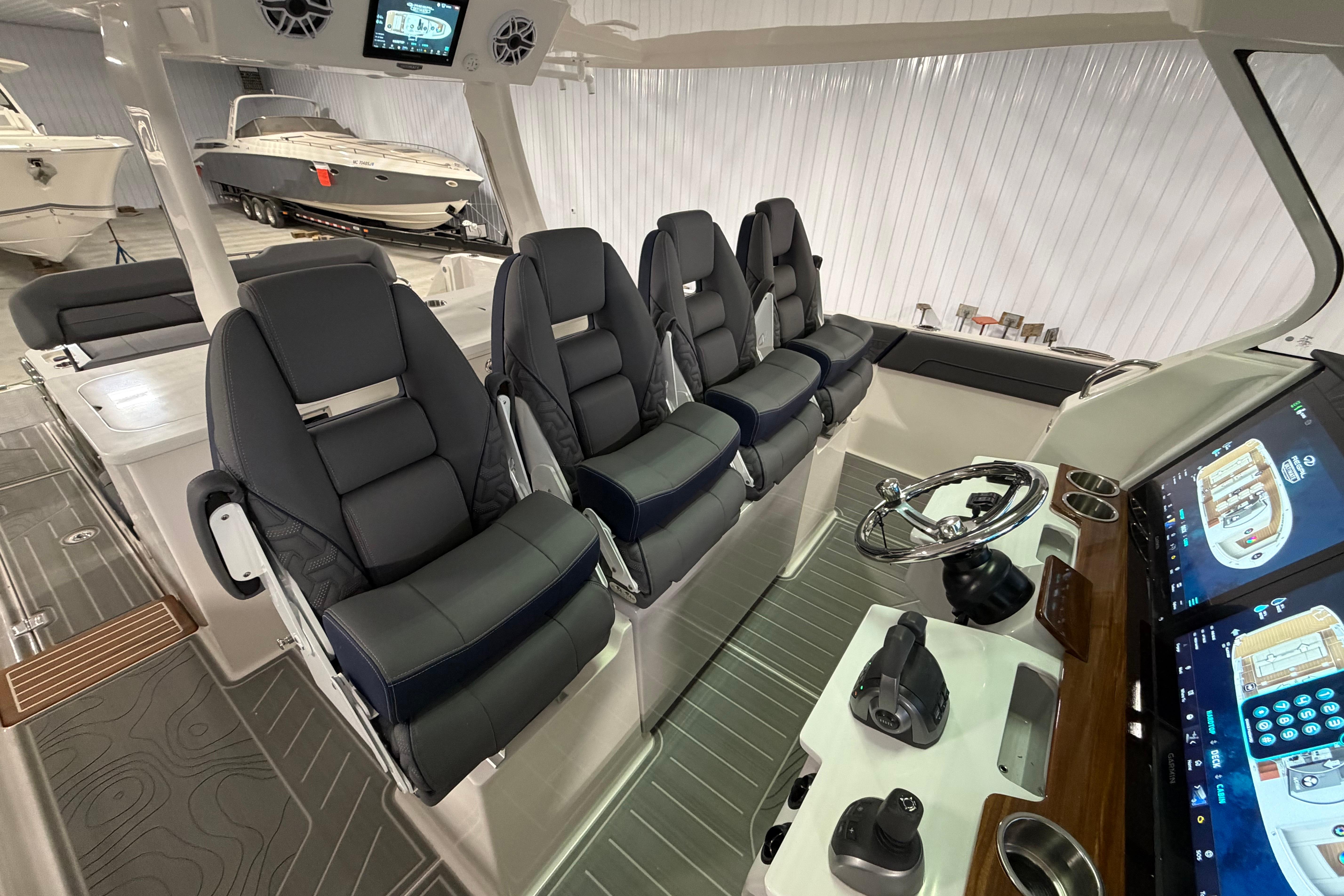 Interior of 2027 Regal 38 Surf boat with modern seating and advanced control panel.