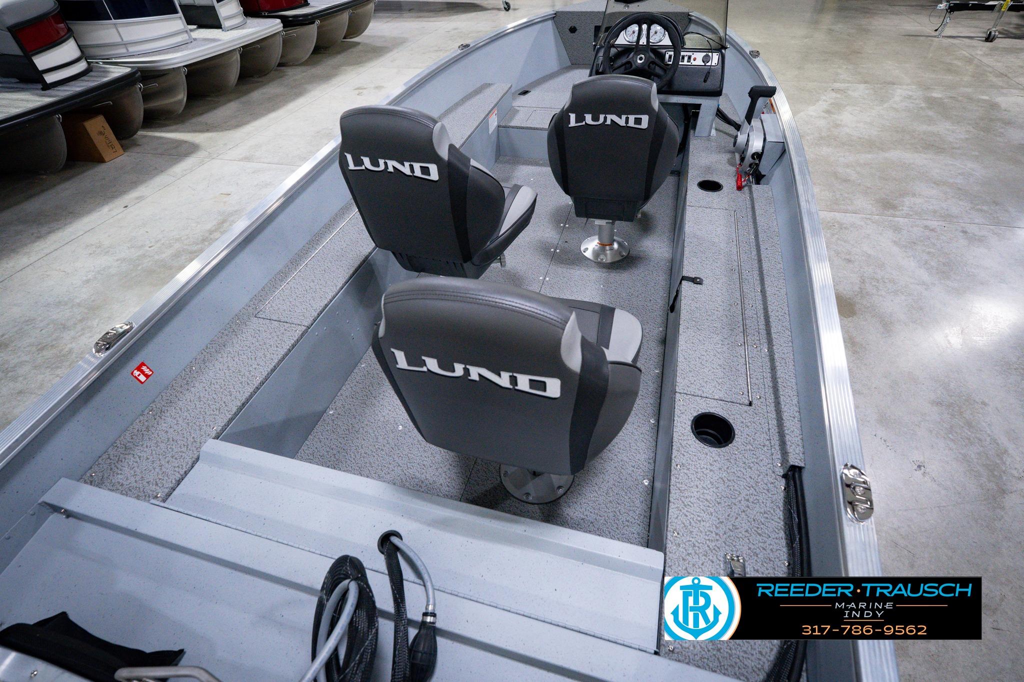 2026 Lund 1600 Fury SS boat interior with branded seats and steering console.