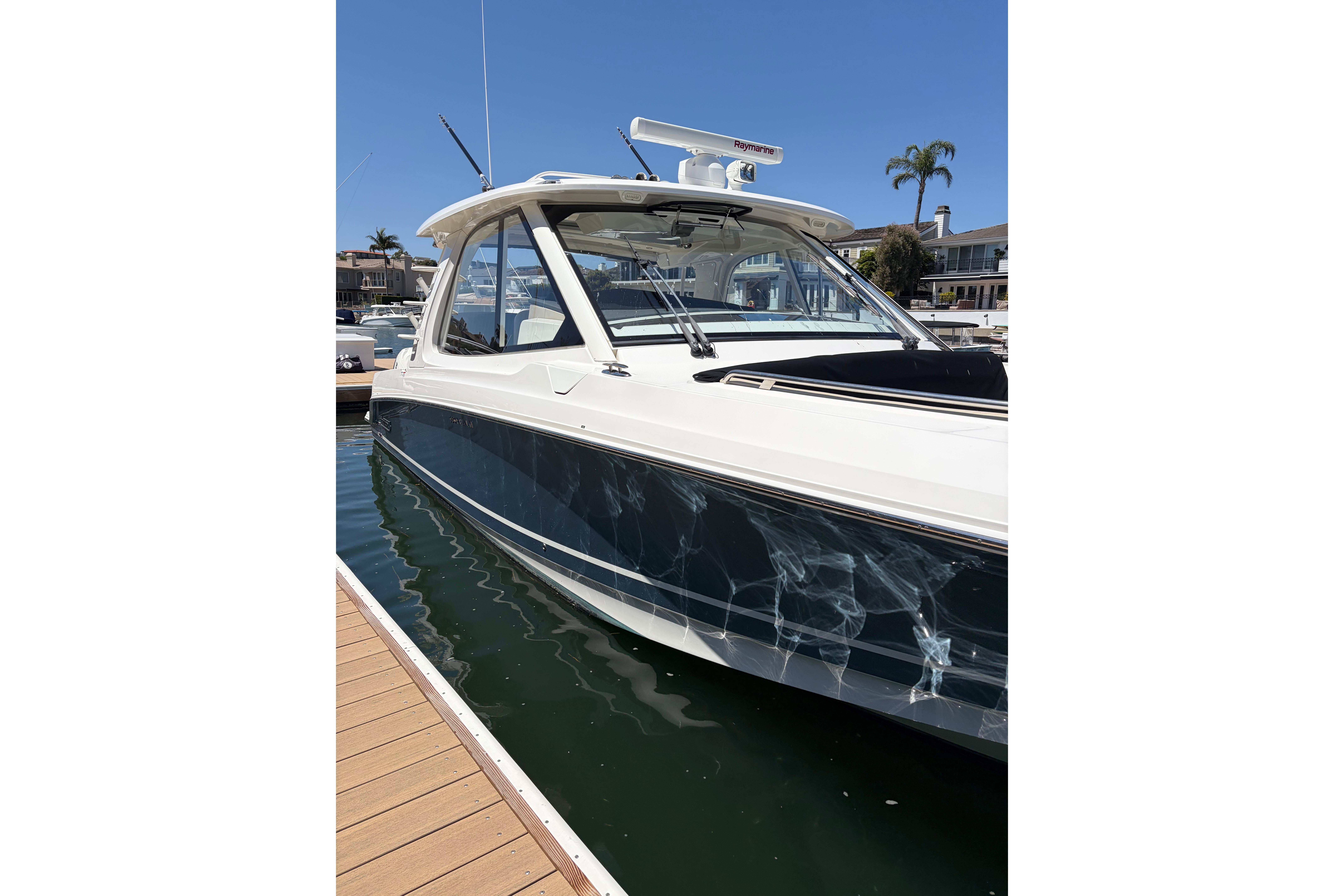 2020 Boston Whaler 380 Realm docked, showcasing sleek design and modern features.