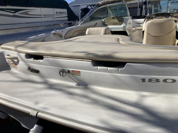2001 Sea Ray 180 Bow Rider boat, white exterior, beige interior, docked in marina.
