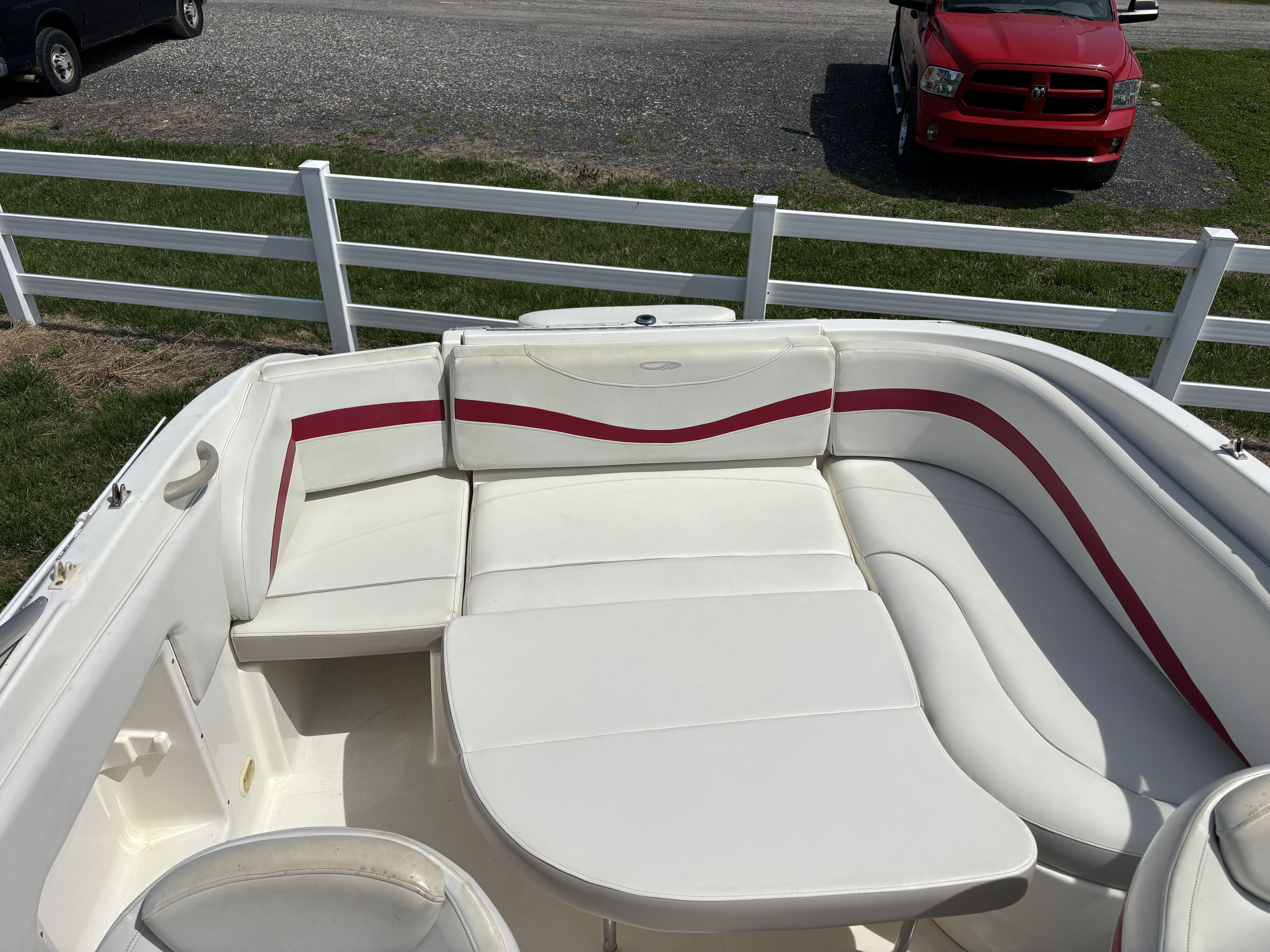 Interior of a 2005 Maxum 2400 SC3 boat with white seating.