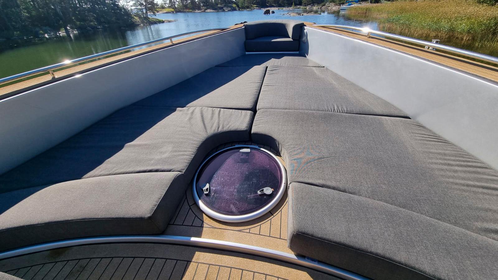 Luxurious 2008 Custom Cantieri Opera 60 yacht deck with cushioned seating and scenic water view.