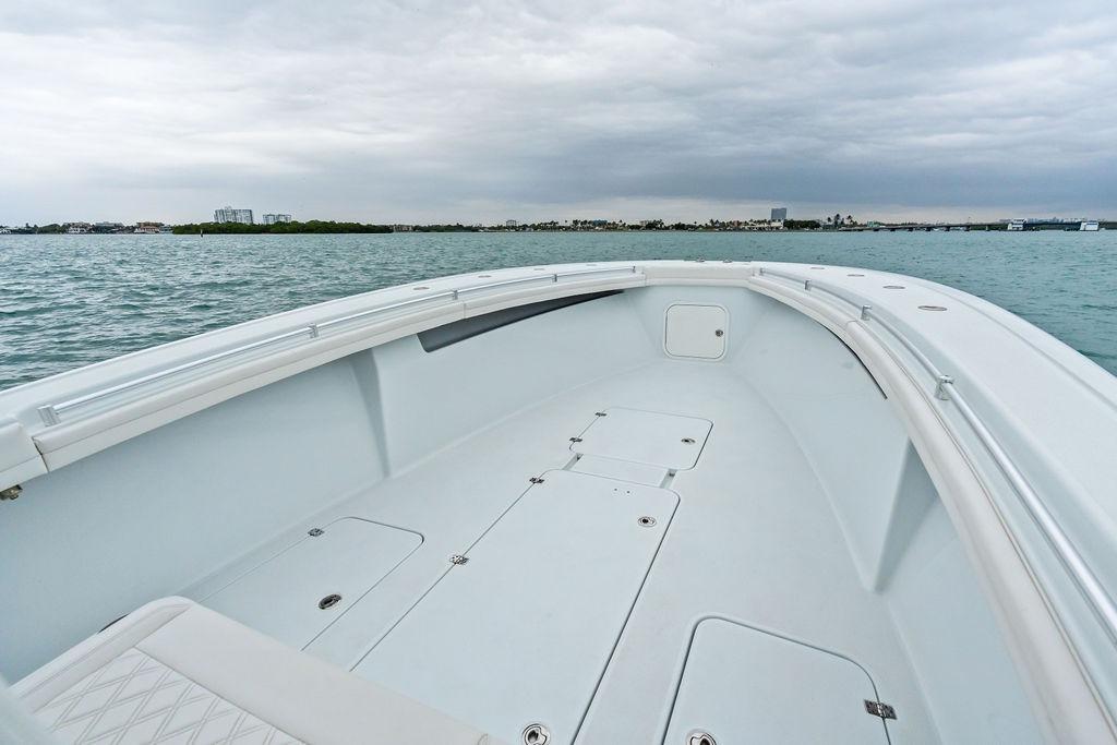 2021 Yellowfin 36 Offshore boat on calm waters under cloudy skies.