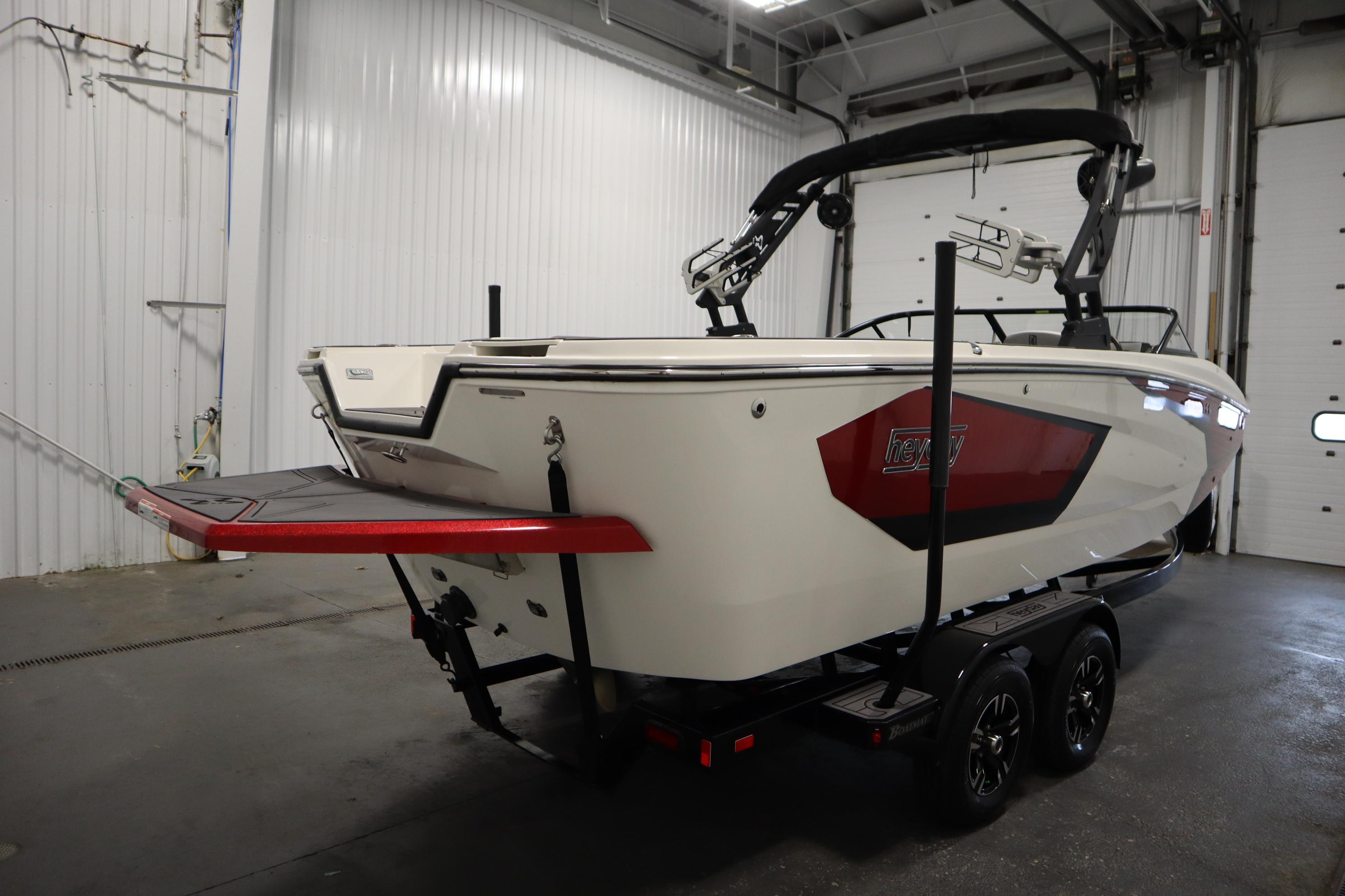 2023 Heyday WT Surf boat on trailer in indoor storage facility.
