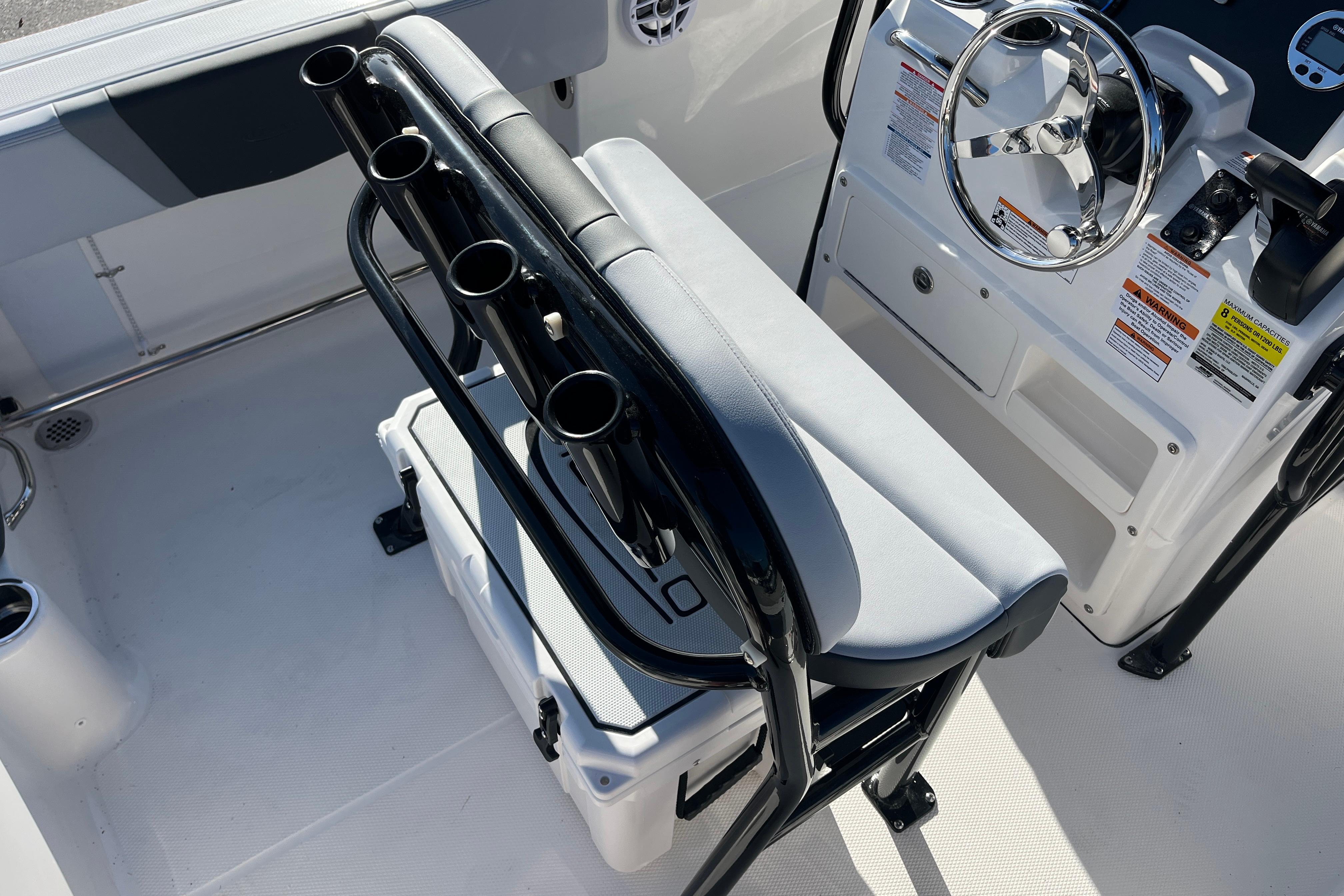 2026 Robalo R200 Center Console boat interior with steering wheel and seating.